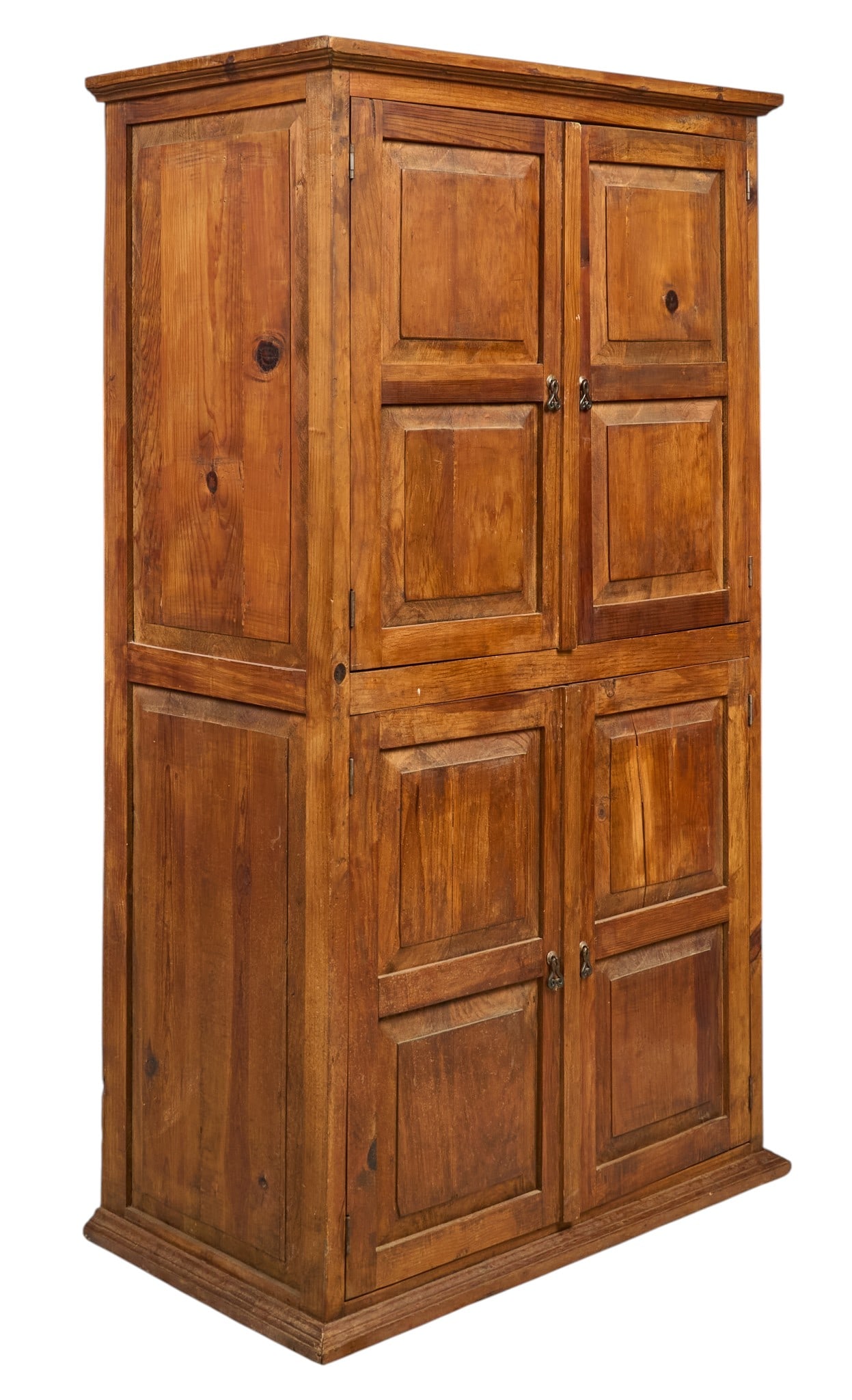 Spanish Colonial Style Armoire: Rustic Spanish Colonial style pine armoire with two sets of paneled doors with iron pulls height 75.5 in. x width 42 in. x depth 25 in. Provenance: Property from a home in Rockport,
