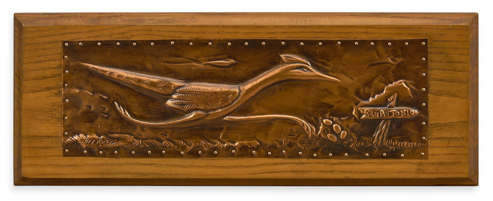 Slim Rustin, Hammered Copper Roadrunner: Slim Rustin (Texas, 20th-21st century), hammered copper roadrunner in mid stride, mounted to wooden panel, with hardware for hanging, signed on reverse height 6 in. x width 15.25 in. x depth 1