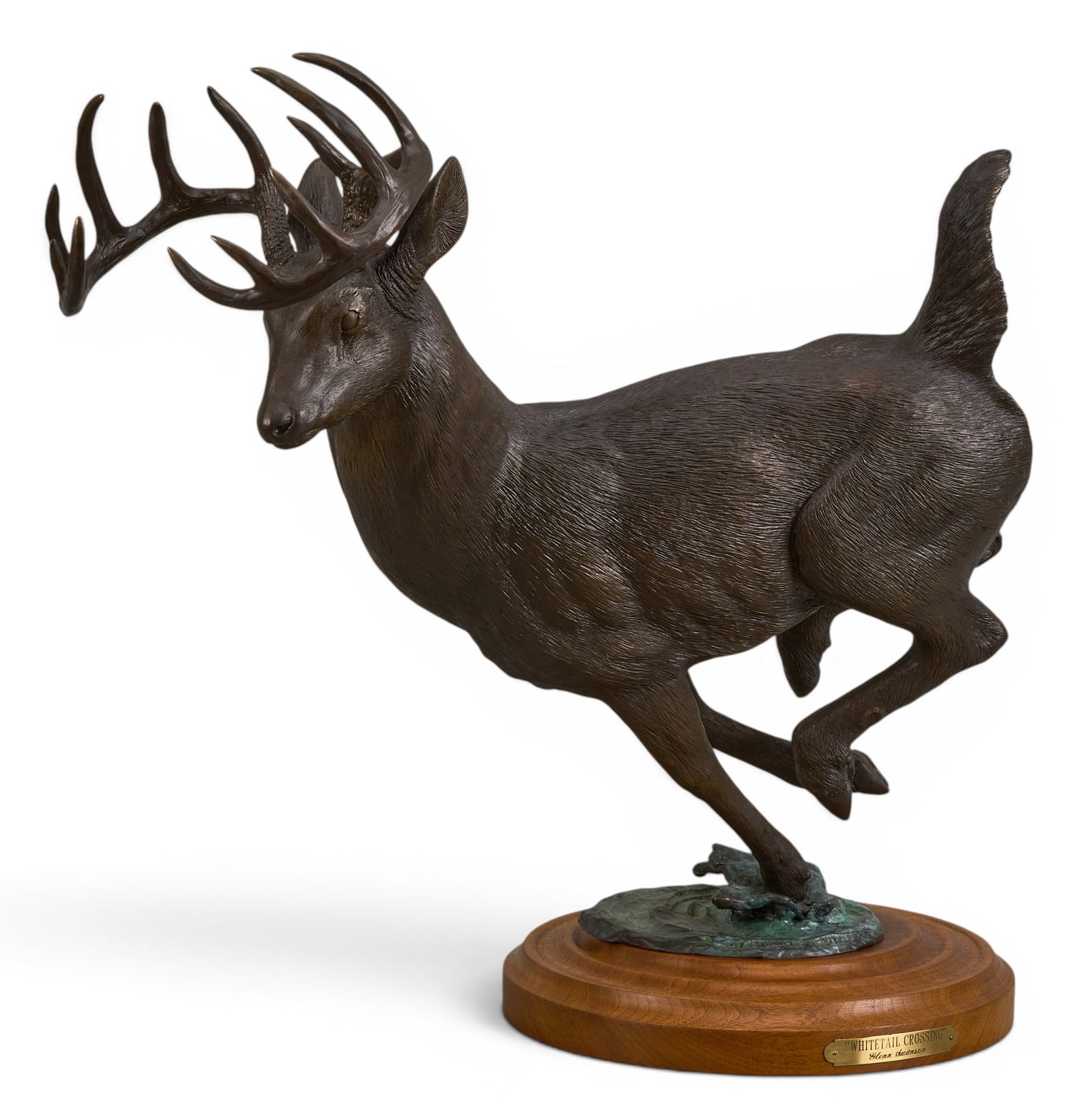 Glenn Swanson, "Whitetail Crossing": Glenn Swanson (Amer., b. 1951), "Whitetail Crossing", artist-cast bronze sculpture on stone and wooden base, incised signature, edition number 8/35, and date, 1986 height 19.5 in. x width