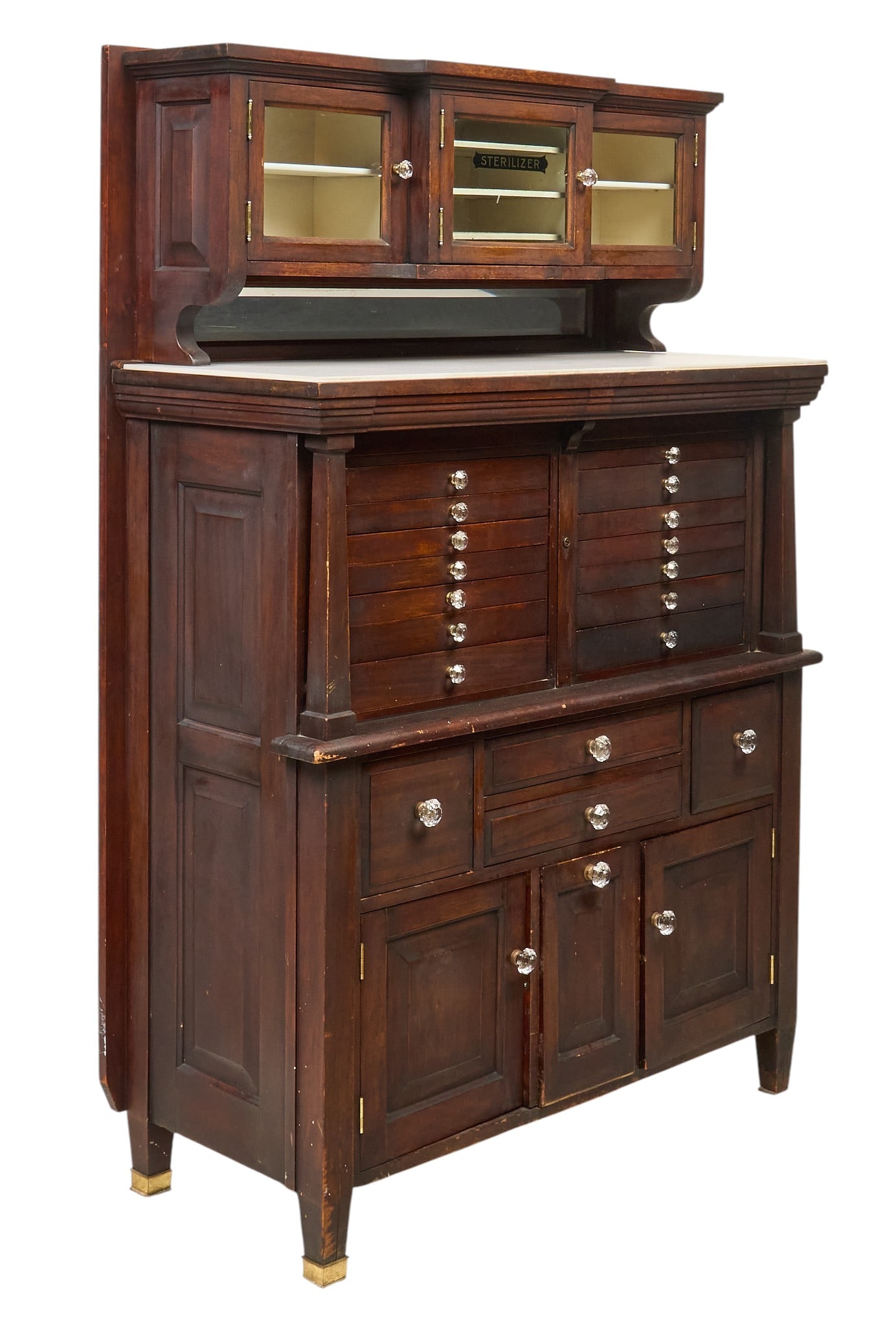 Antique Dental Cabinet: Antique dental cabinet with a hutch with glass-fronted doors, a marble top, and twenty-one drawers and cabinets below with decorative pulls height 61 in. x width 41 in. x depth 18 in. Provenance: