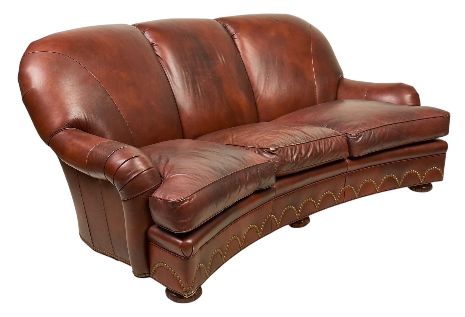 Vintage Leather Three-Seater Sofa: Vintage brown leather three-seat sofa, with a curved silhouette, plush cushions, and a decorative nailhead trim along the base height 38 in. x width 87 in. x depth 51 in.