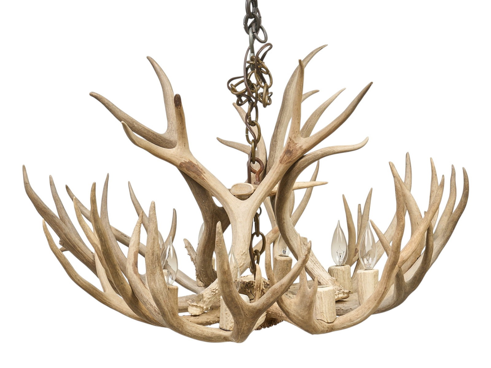 Antler Chandelier: Rustic antler chandelier, with a multi-tiered design and multiple candle-style light fixtures, with wiring and hardware for hanging height 21 in. x width 32 in. x depth 34 in.
