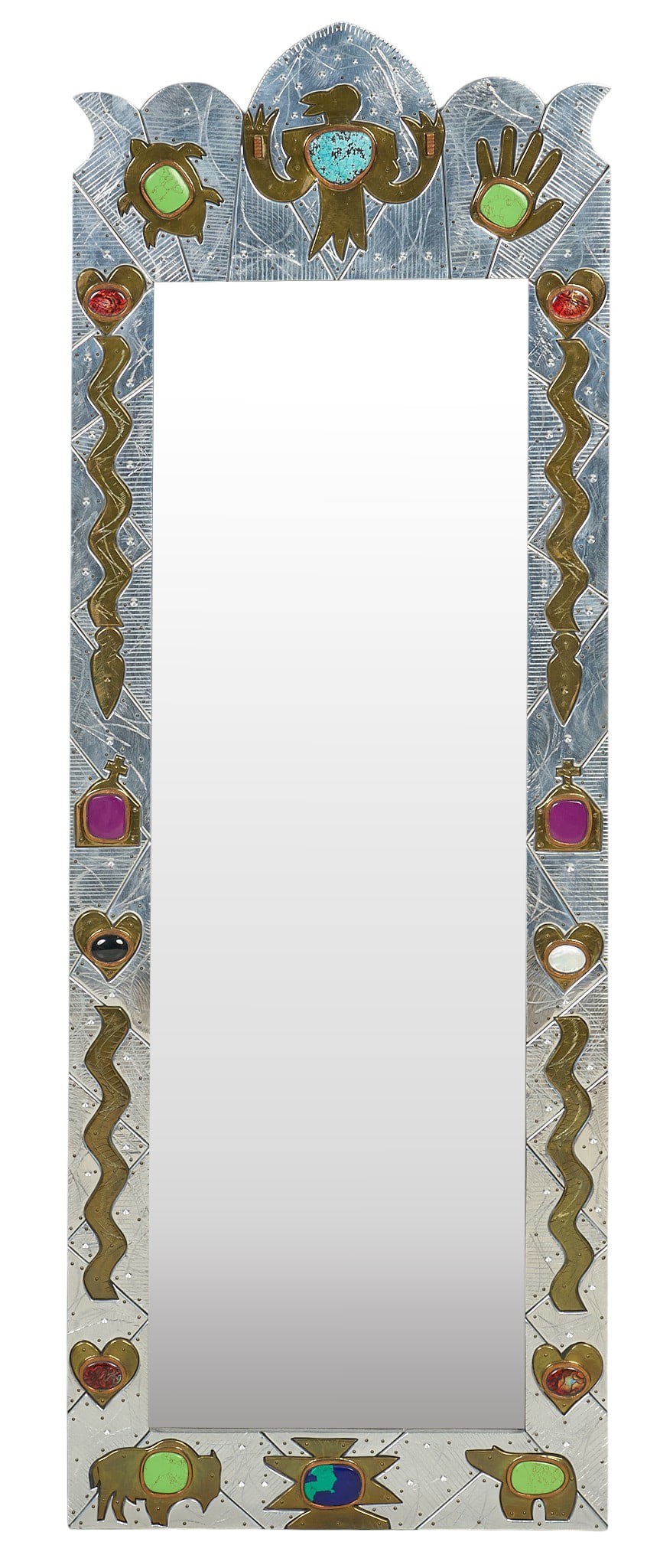 Southwestern Style Folk Art Mirror: Southwestern style folk art mirror with tooled silver-toned metal overlaid on wooden frame set with various stones and motifs height 62 in. x width 22.5 in. x depth 1 in. Provenance: Property