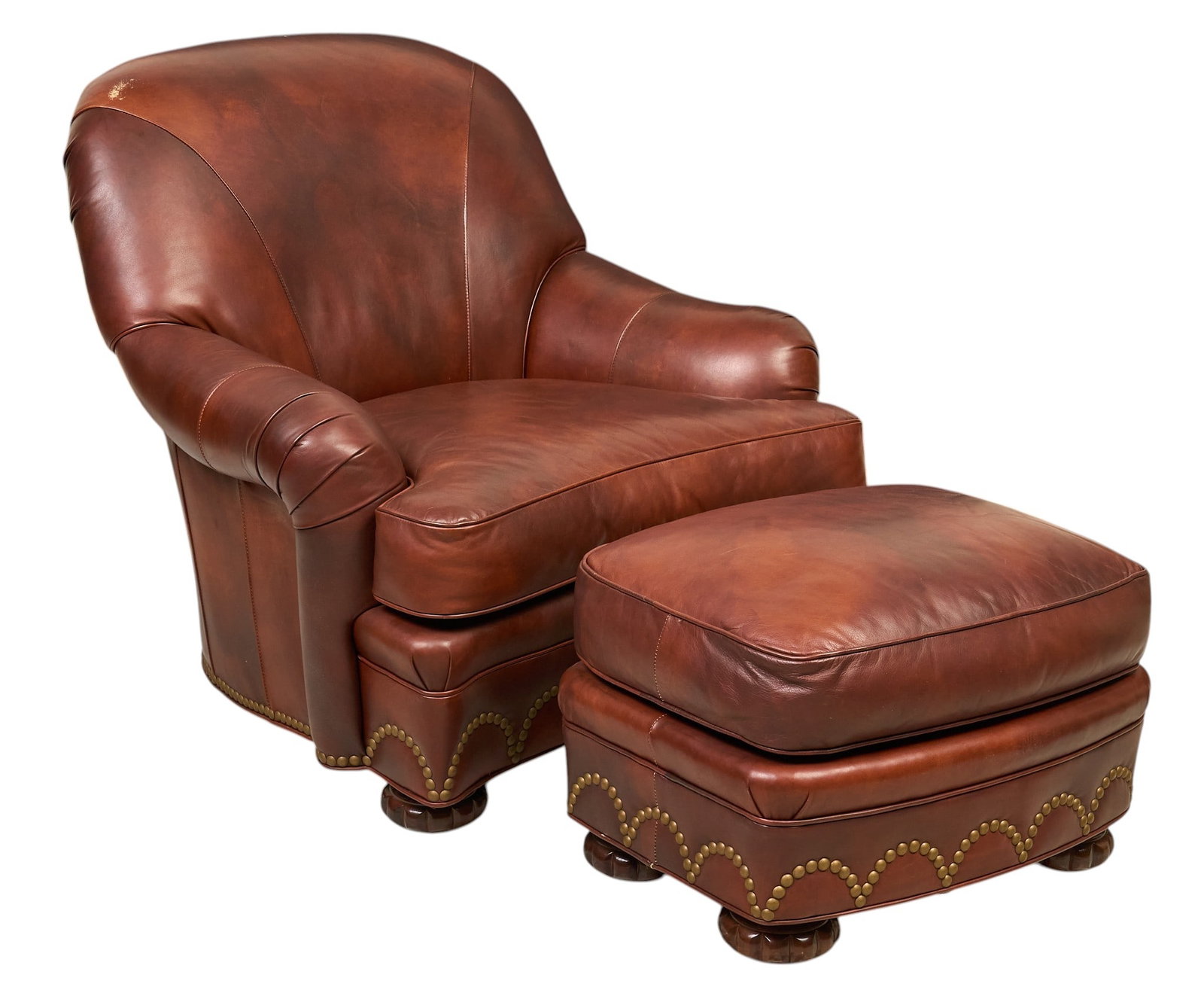Hancock and Moore, Leather Chair: Hancock and Moore leather armchair and ottoman with metal nail trim height 38 in. x width 40 in. x depth 40 in. Provenance: Property from the Estate of Robert A. "Bob" Funk Sr. -