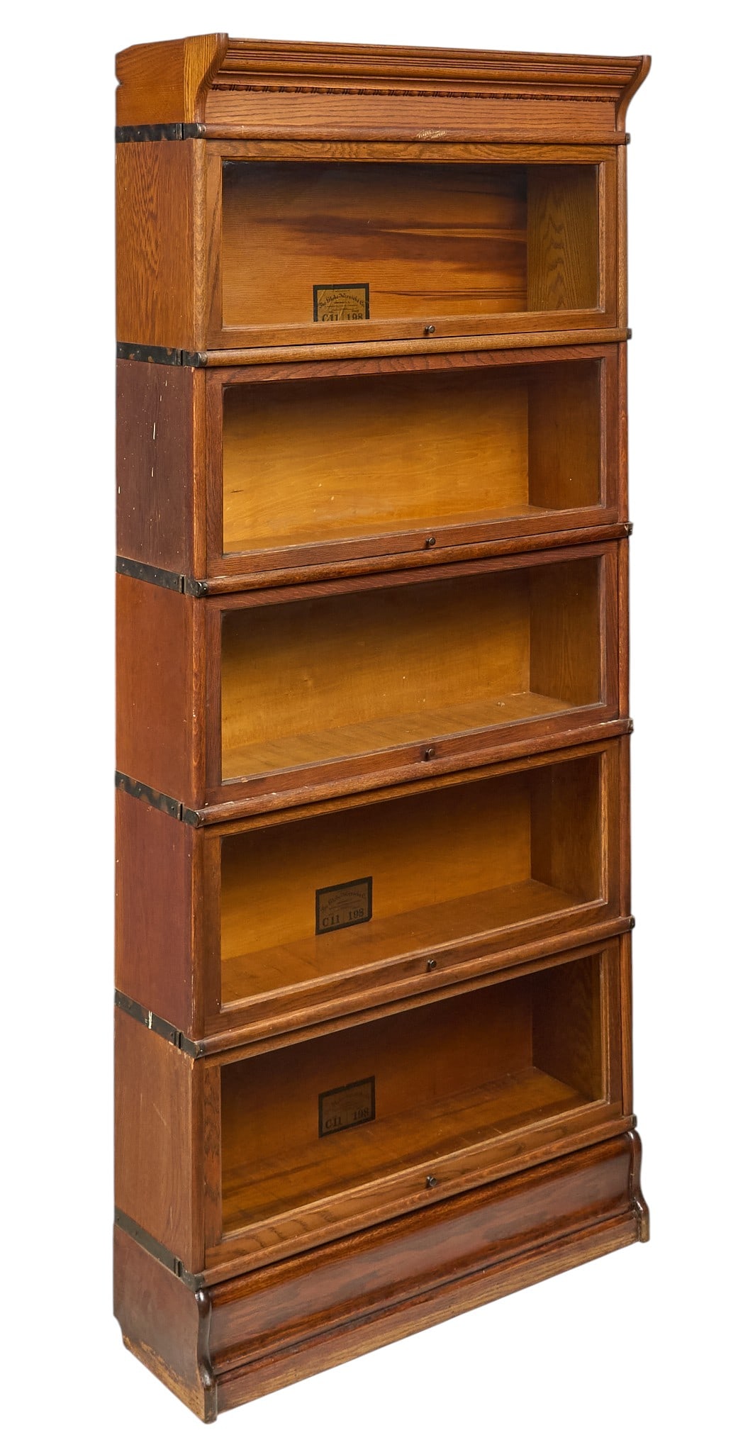 5-Tier Barrister Bookcase: Five-tier stacking barrister bookcase with glass-front doors, supported on plinth, with three out of five modules marked with Globe-Wernicke Co. label height 77 in. x width 34 in. x depth 12 in.