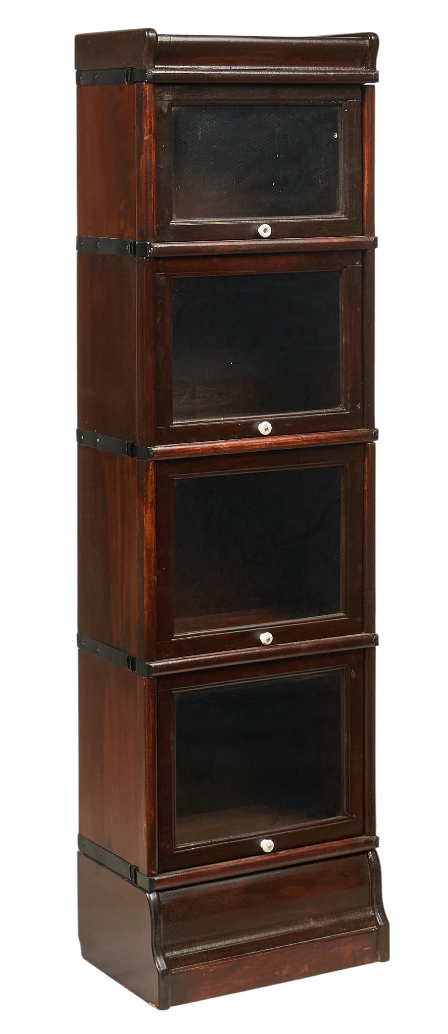 Narrow Stacking Bookcase: Narrow stacking bookcase with four glass-front modular tiers, with crown and base height 60 in. x width 17 in. x depth 9.5 in. Provenance: Property from a home in San Antonio, Texas