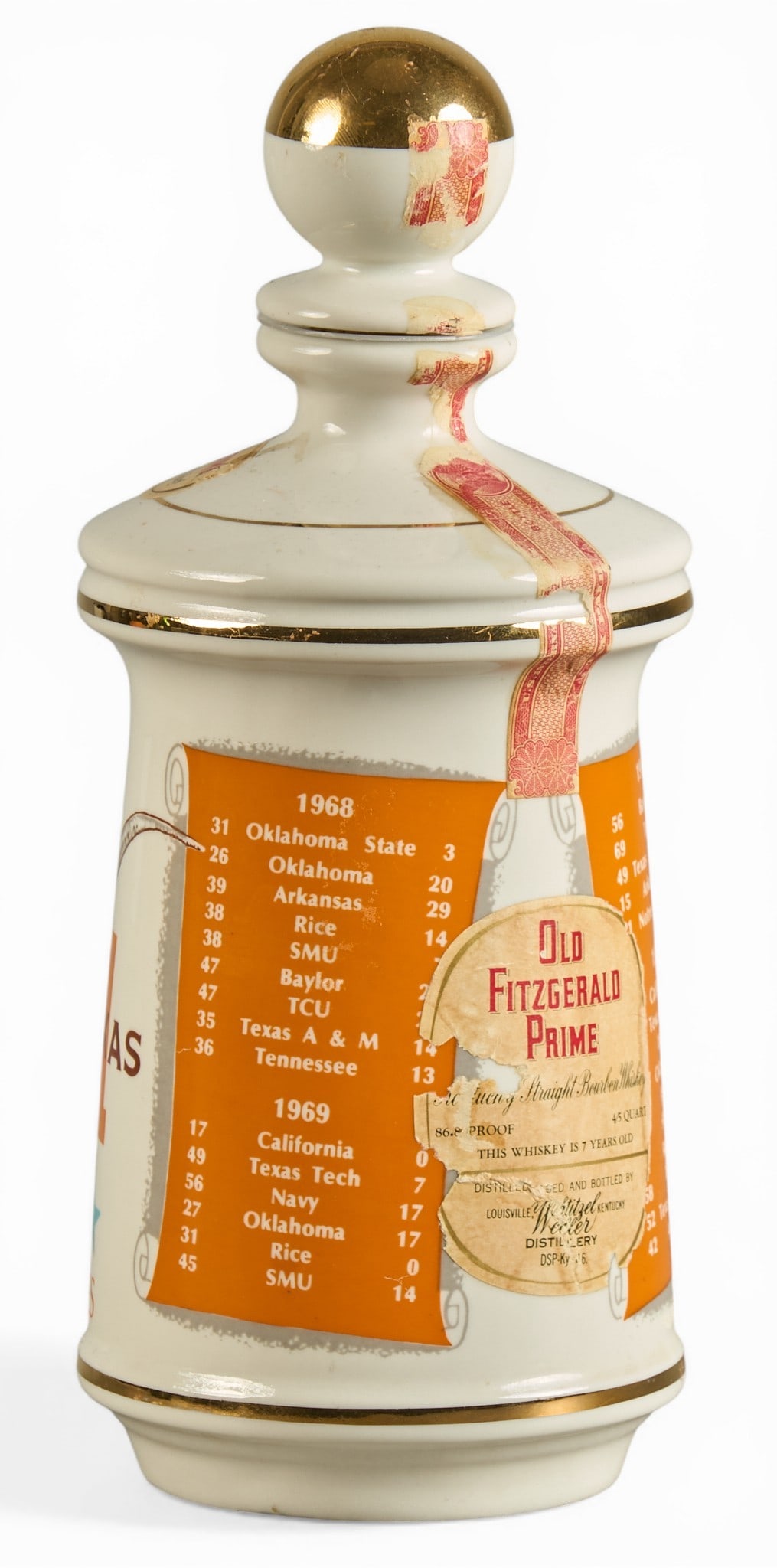 University of Texas Championship Decanter: University of Texas commemorative decanter celebrating thirty straight victories, with team scores and "Hook 'em Horns" branding, includes original Old Fitzgerald Prime la