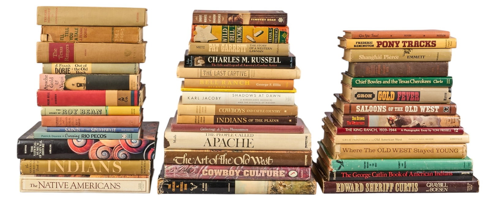 Collection of Western and Native American Themed Books: Collection of books focusing on the American West, Native American culture, and cowboy life, includes titles such as "The American Heritage Book of Indians", "Indians of the Plains
