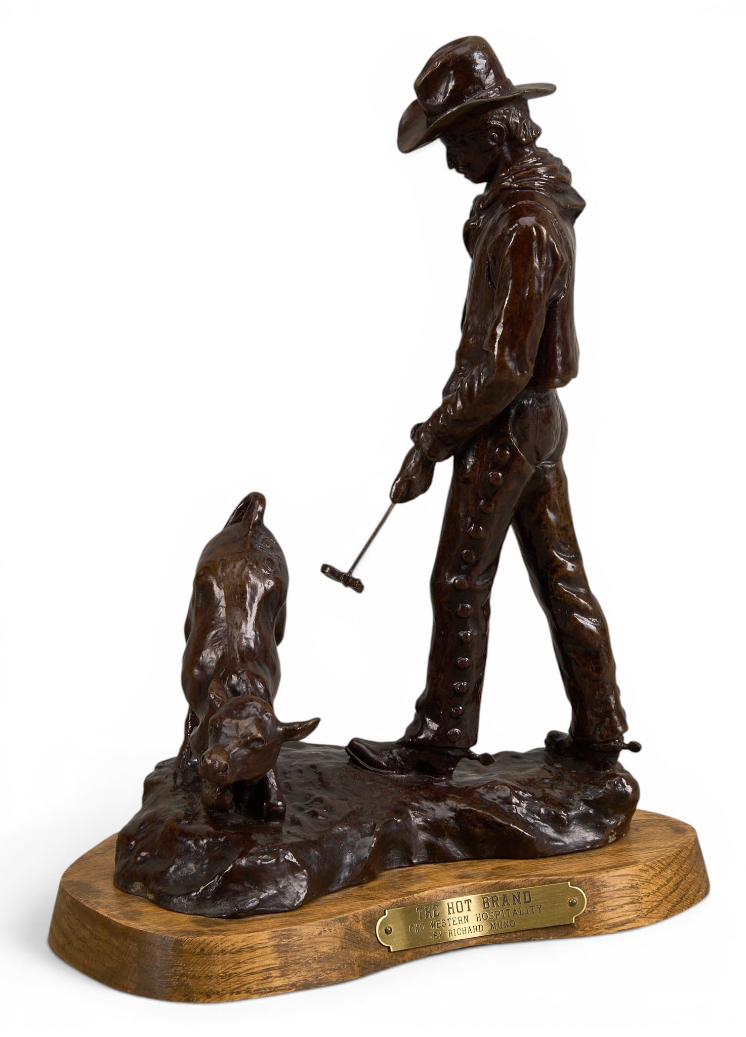 Richard Muno, "The Hot Brand": Richard Muno (Oklahoma, 1939-2015), "The Hot Brand", artist-cast bronze sculpture on wooden base height 11 in. x width 8.5 in. x depth 5.5 in. (including base) Provenance: Property