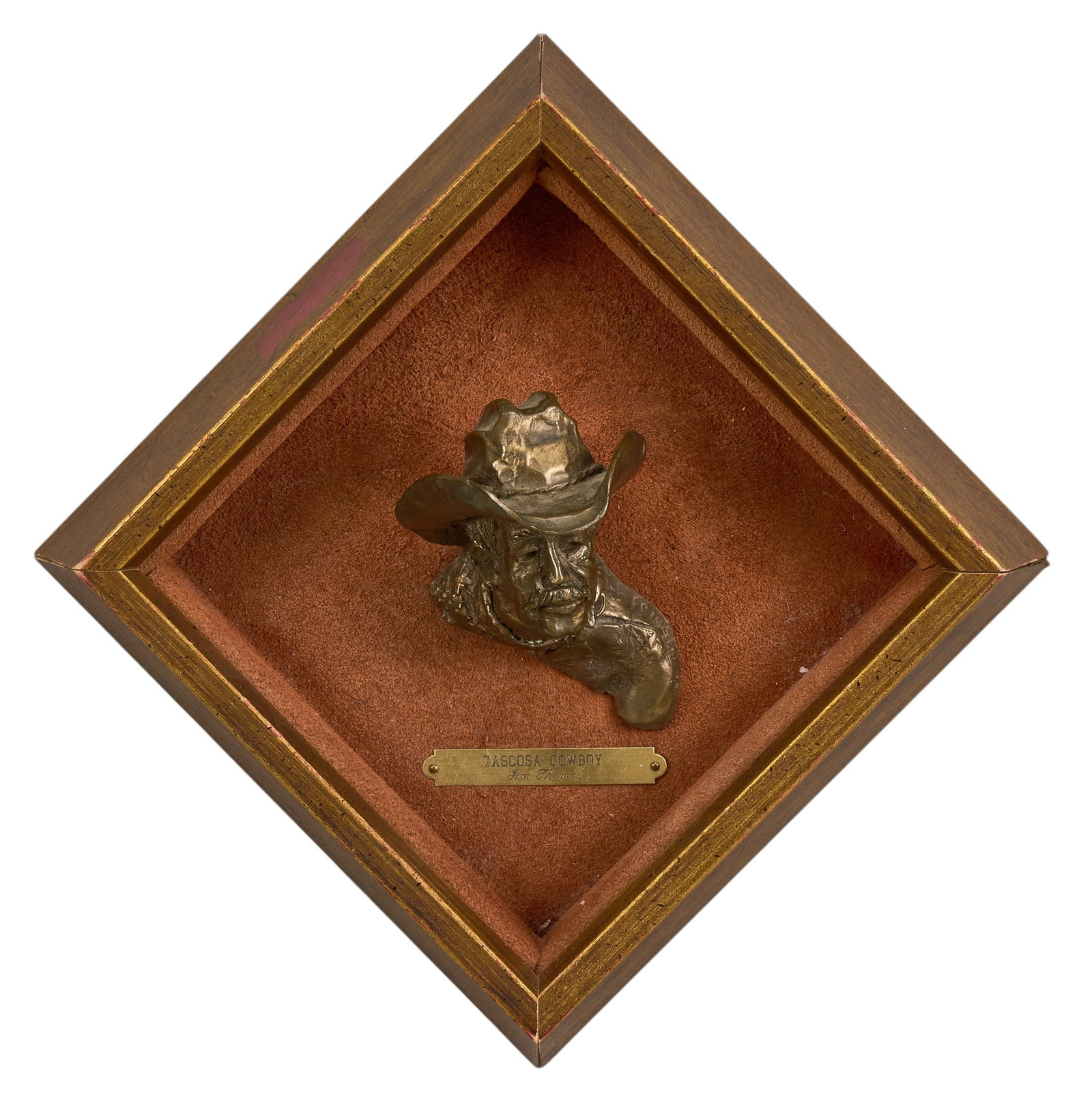 Jim Thomas, "Tascosa Cowboy": Jim Thomas (Texas, 20th-21st C.), "Tascosa Cowboy", artist-cast bronze mounted in shadowbox frame, incised signature height 10.5 in. x width 10.5 in. x depth 3.5 in. Provenance: