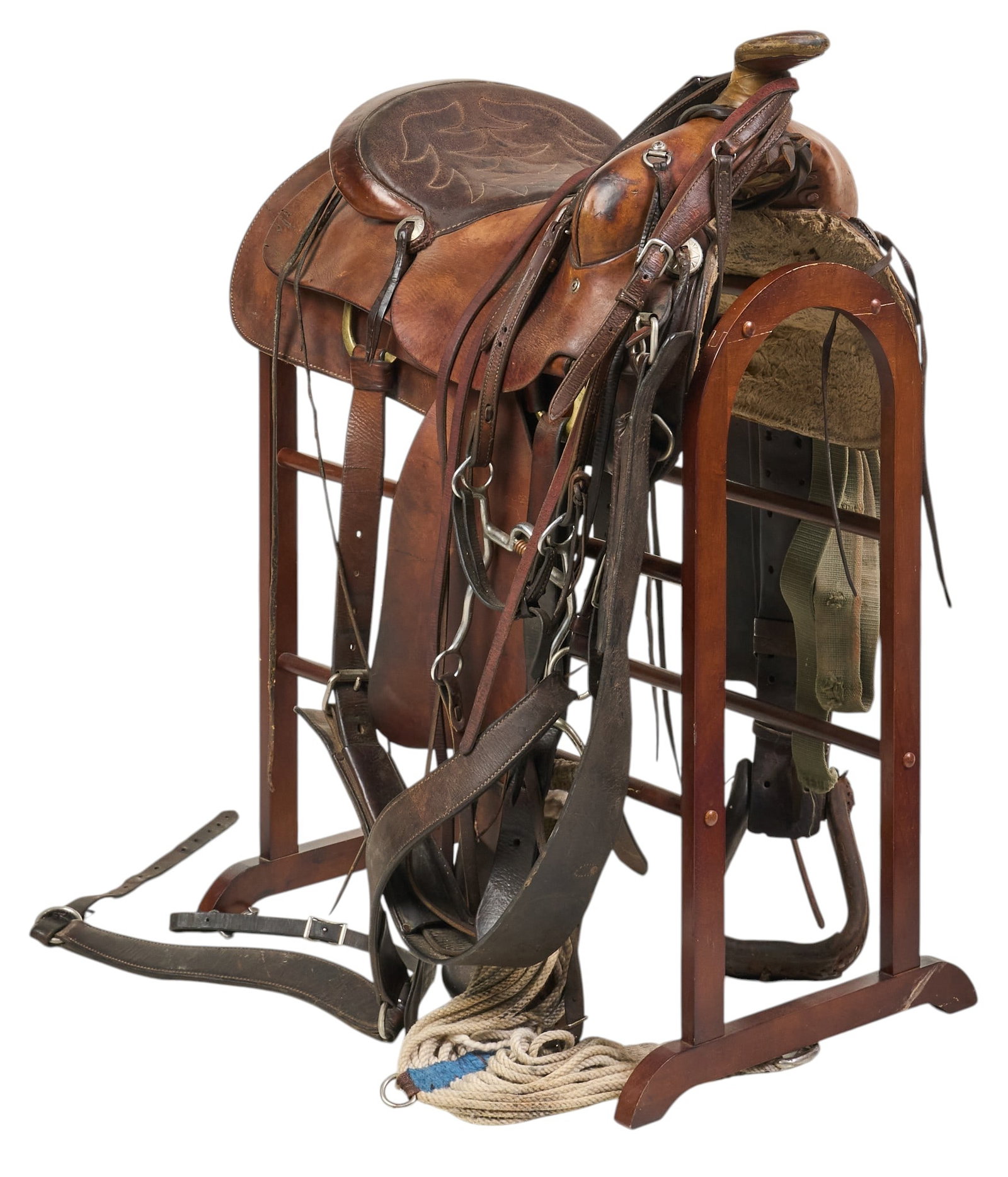 Simco Riding Saddle: Simco leather riding saddle with leather pommel, metal conchos, and leather stirrups, marked "5550", includes wooden stand height 39 in. x length 27 in. x width 18 in. / saddle