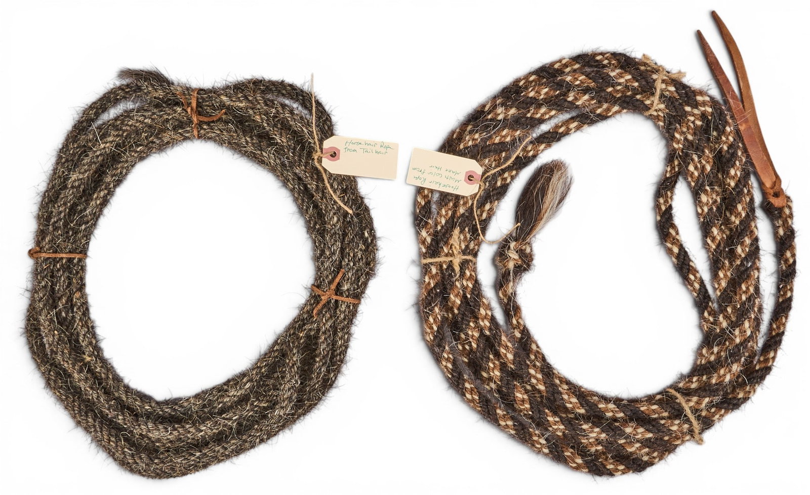 (2) Vintage Horse Hair Ropes: Two vintage horse hair ropes, with darker example being made from tail hair, and the polychrome example being mane hair diameter 13 in. x depth 2 in. / largest, coiled Provenance: