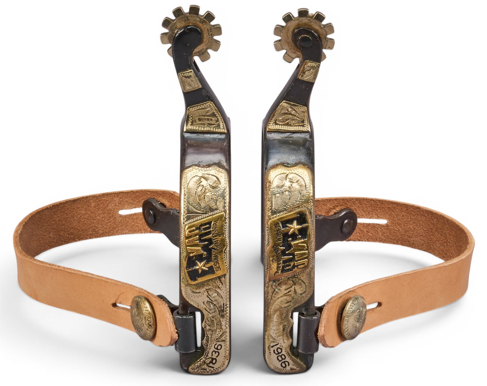 Pair of Vintage Texas Sesquicentennial Spurs: Pair of Texas Sesquicentennial spurs, marked "154", circa 1980 length 5.5 in. heel width 3.5 in. rowel diameter 1.5 in. Provenance: Property from a home in Mathis, Texas