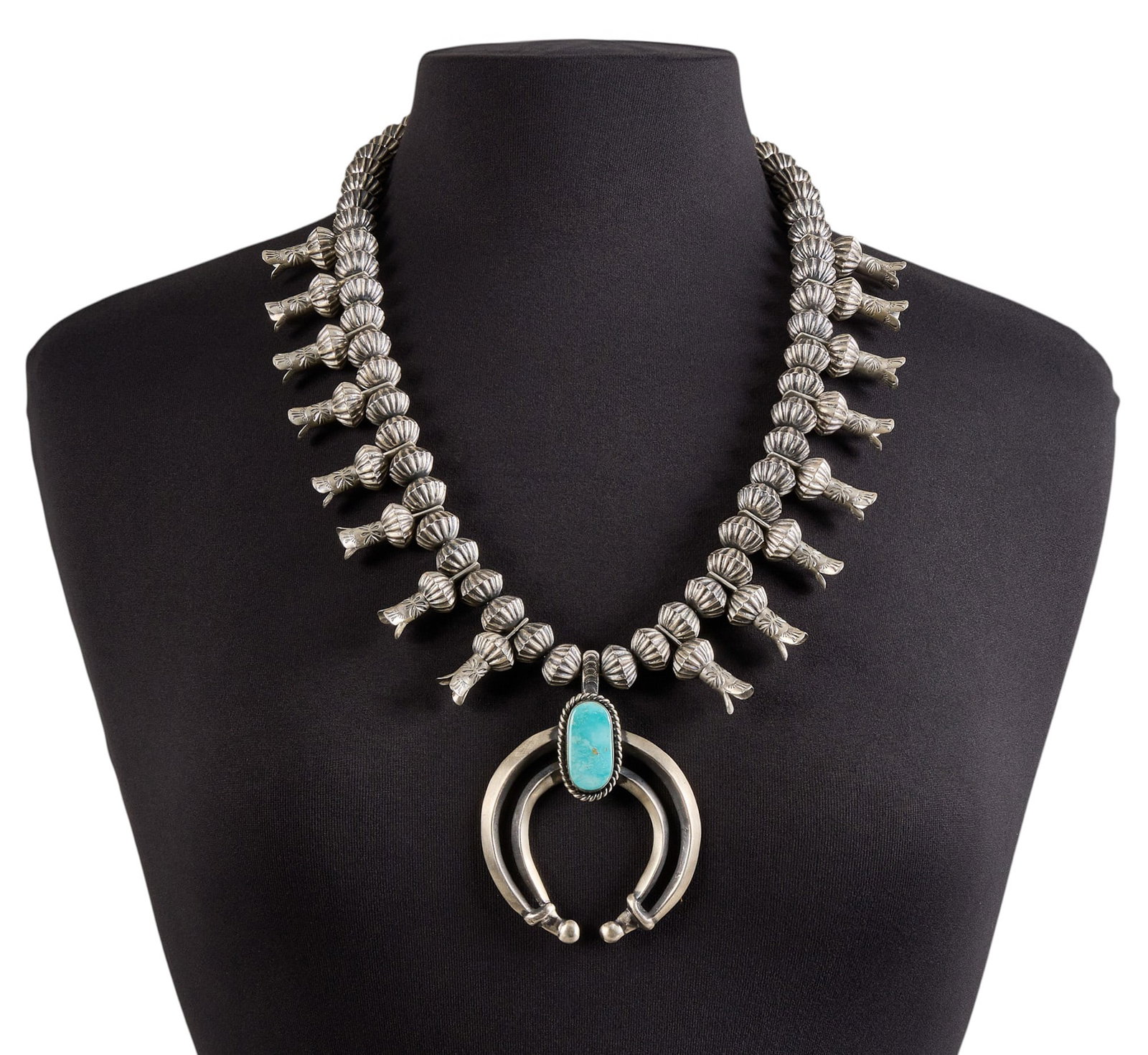 Contemporary Sterling & Turquoise Squash Blossom: Chris Hale, contemporary sterling silver squash blossom necklace, set with single turquoise cabochon to naja, with stamped details throughout, and hook and eye closure, signed "C. Hale Sterling&q