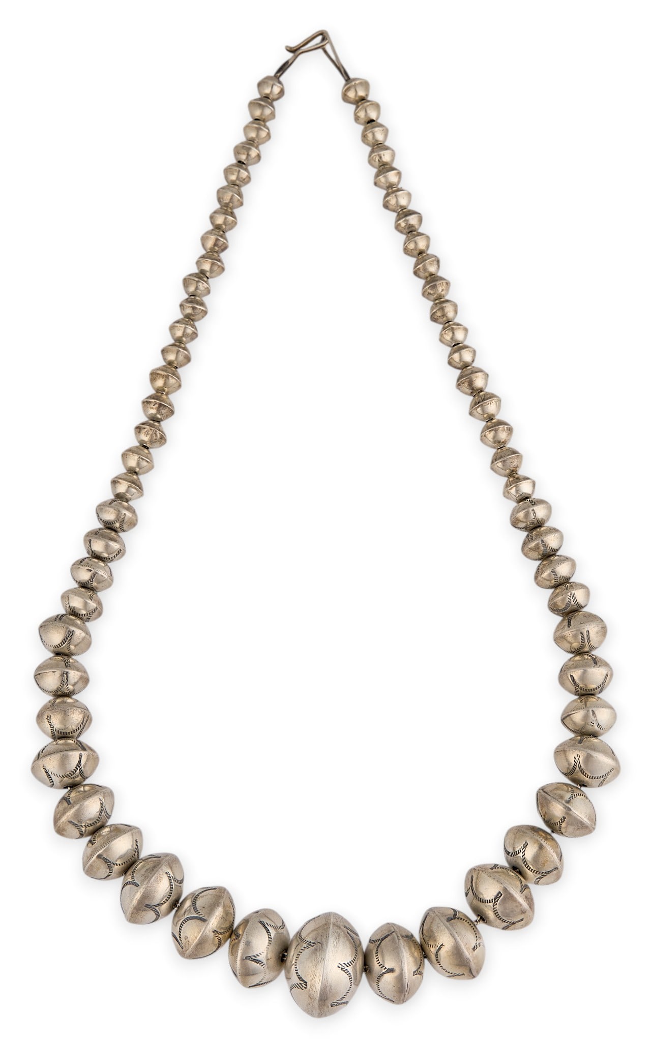 Sterling Silver Navajo Pearl Necklace: Sterling silver Navajo pearl necklace, featuring hand-stamped details to beadwork, and hook and eye closure Length: 23 in. Total weight: 74.7 g