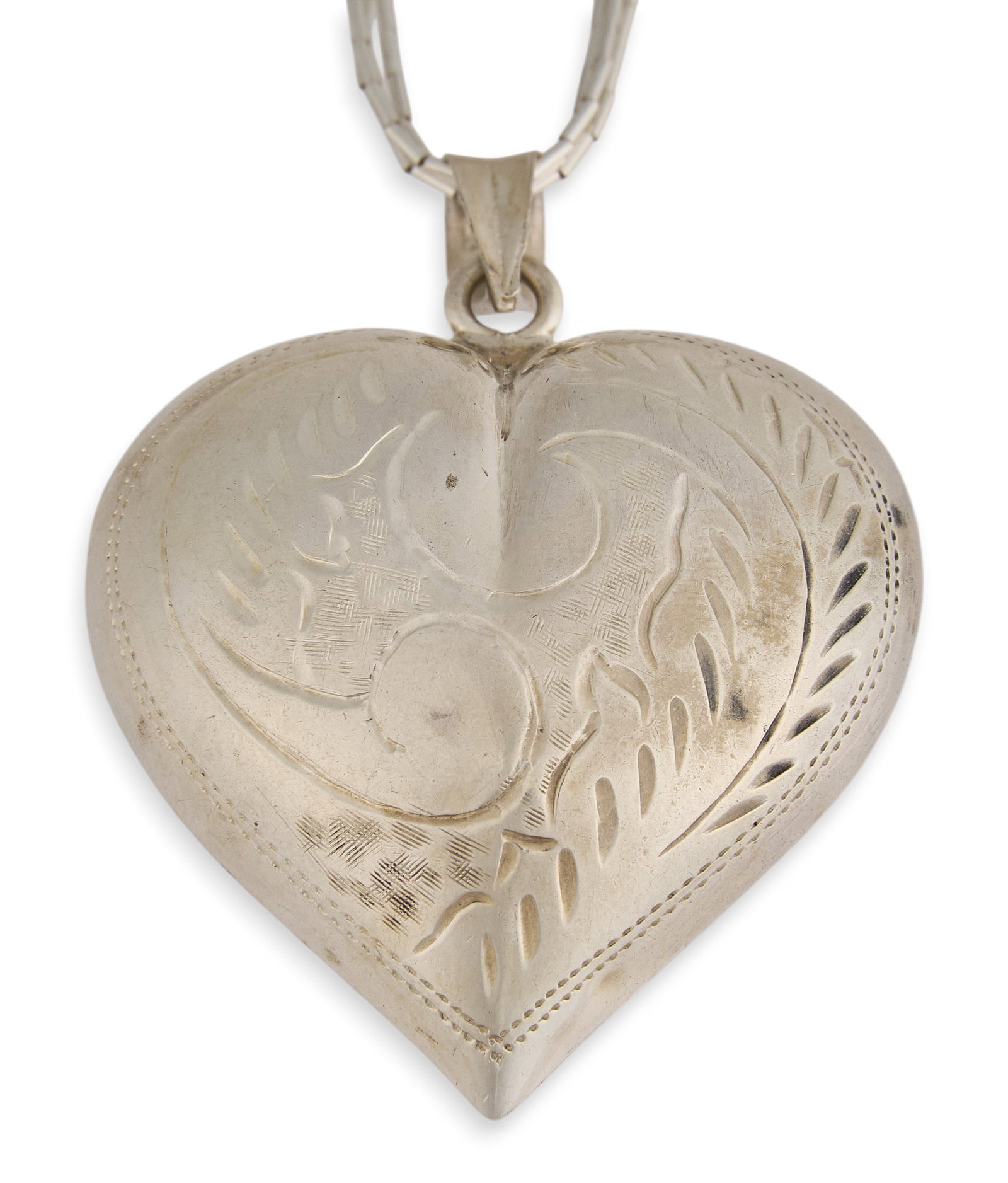 Multi-Strand Heart Pendant Necklace: Sterling silver multi-strand heart pendant necklace, by Running Bear Trading Co., with stamped details to pendant, marked by maker near clasp Length: 24 in. Total weight: 14.4 g