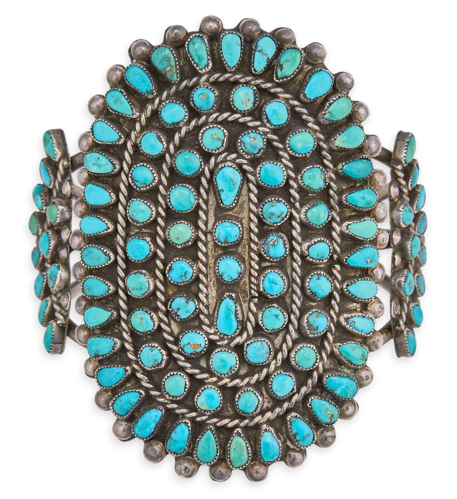 Zuni Sterling Silver & Turquoise Petit Point Cuff: Zuni sterling silver cuff bracelet, set with turquoise cabochons in petit point design, featuring twisted rope motifs Circumference: 6 in. Total weight: 58.7 g