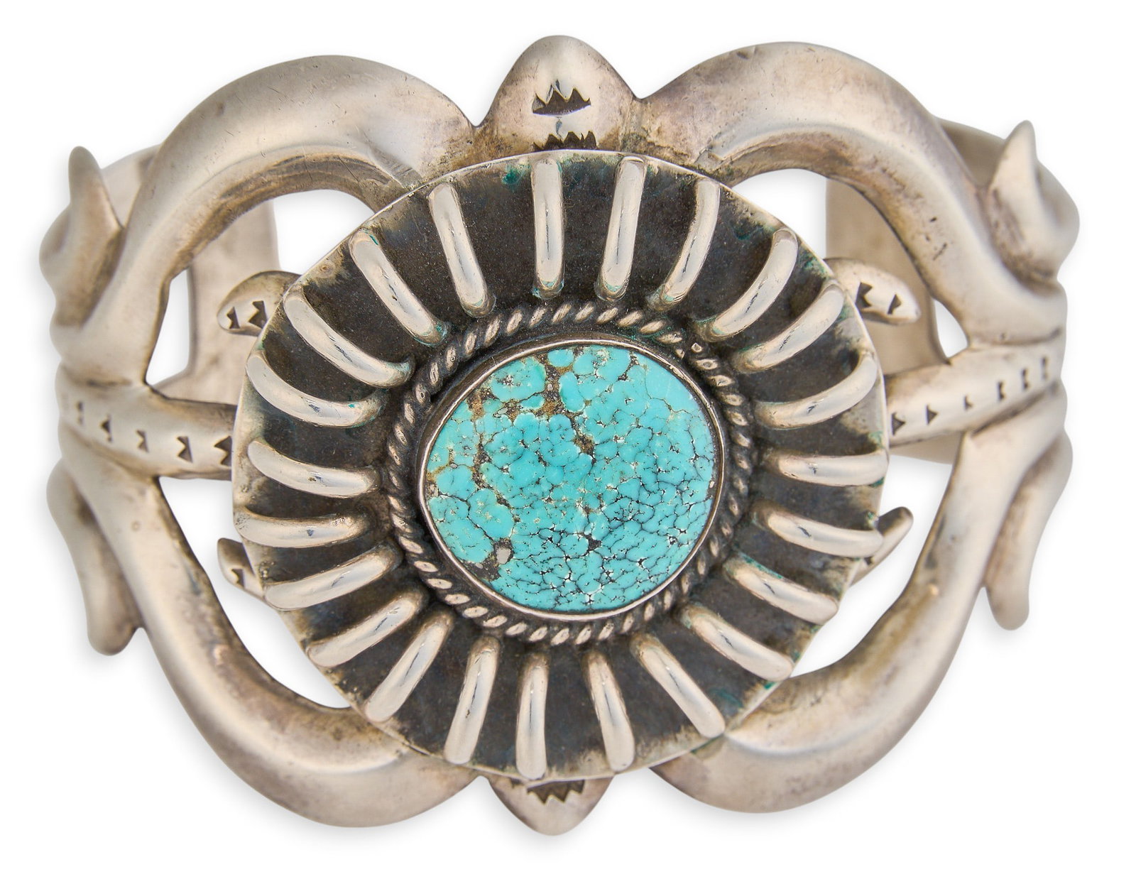 Native American Sterling & Turquoise Cuff: Native American sterling silver cuff bracelet, set with single turquoise cabochon, with twisted rope motif and stamped details Circumference: 7 in. Total weight: 101.3 g