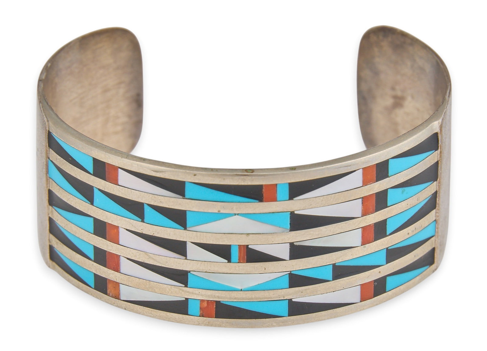 Zuni Style Multi-Stone Inlay Cuff: Zuni style sterling silver cuff bracelet, set with multi-stone inlay, featuring turquoise, onyx, mother of pearl, and coral in geometric design Circumference: 6.25 in. Total weight: 31.0 g