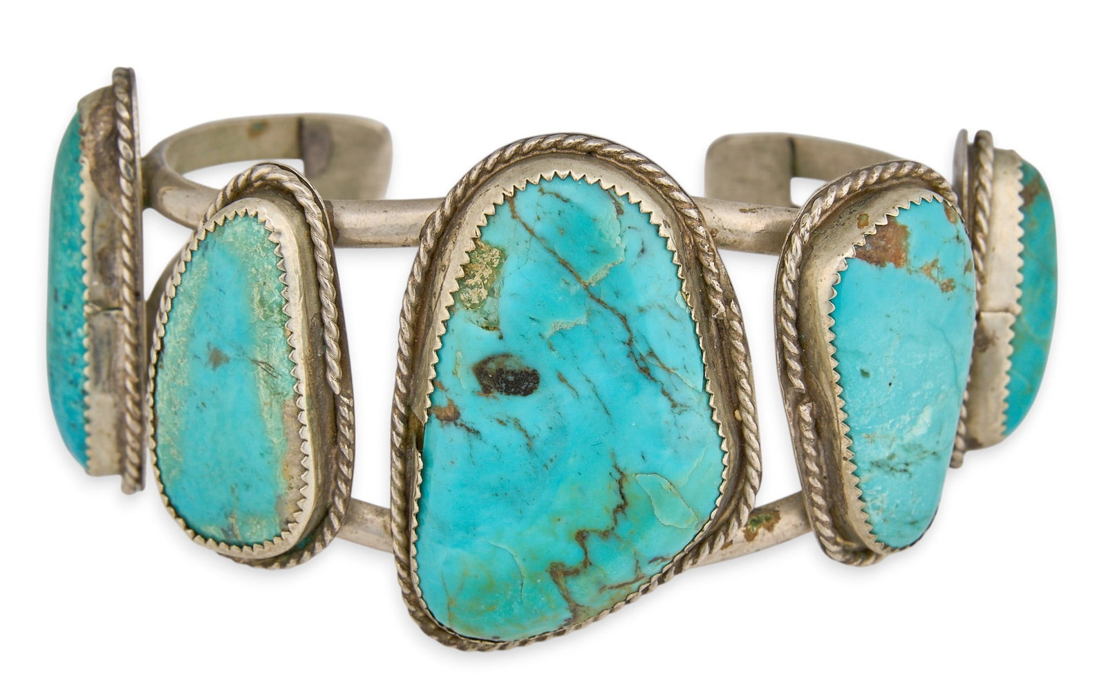 Sterling Silver & Turquoise Cuff: Sterling silver cuff bracelet, set with five turquoise stones, and featuring twisted rope motifs Circumference: 7 in. Total weight: 62.5 g