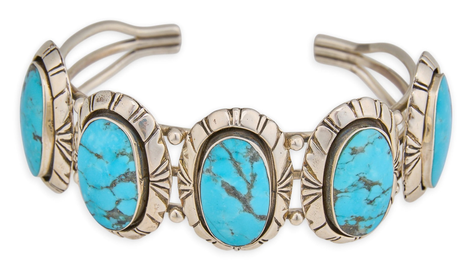 Sterling Silver & Turquoise Cuff: Sterling silver cuff bracelet, set with five turquoise cabochons and stamped details, marked "925" Circumference: 7.25 in. Total weight: 56.8 g