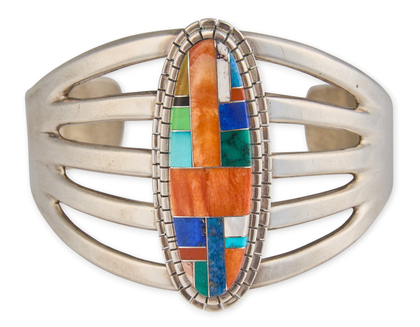 Southwestern Sterling & Multi-Stone Inlay Cuff: Southwestern sterling silver cuff bracelet, set with multi-stone inlay, marked "Sterling", with maker's stamp Circumference: 7 in. Total weight: 72.1 g Provenance: Property from a San An