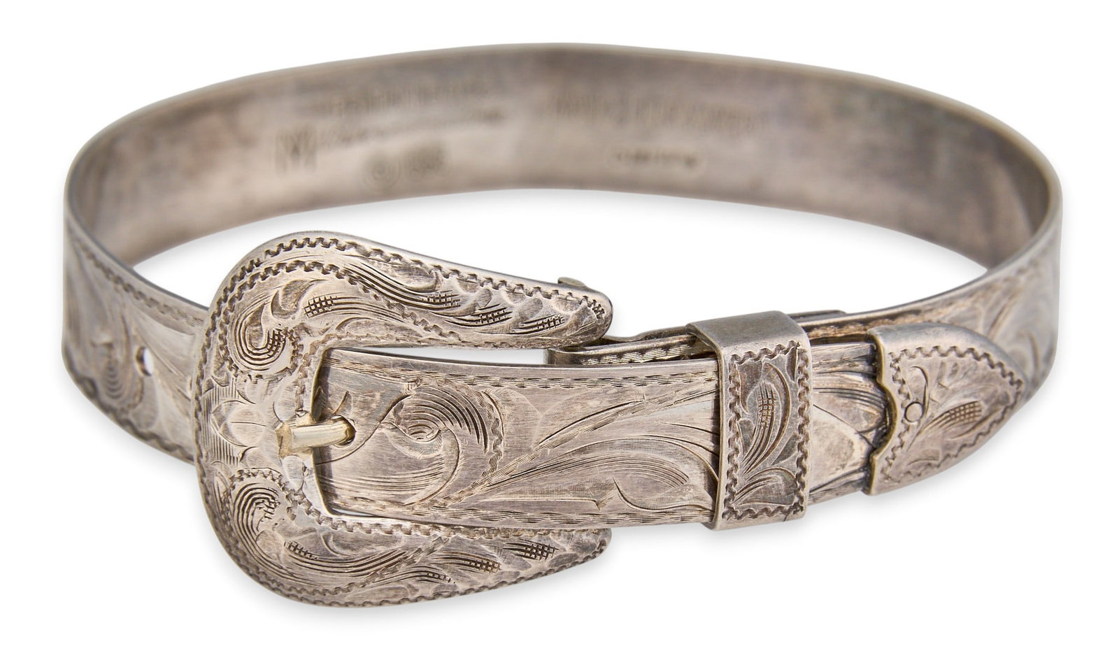 Vintage Sterling Silver Belt Buckle Bracelet: Fritch Bros Silversmiths, vintage sterling silver cuff bracelet in the form of a belt with buckle, with adjustable size via punch holes, marked to interior, and dated 1993 Circumference: 6.5 in. Total