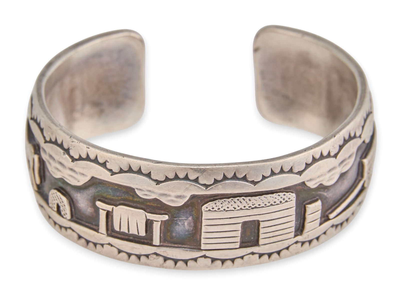 R.H. Begay, Navajo Sterling Storyteller Cuff: Roland Hogan Begay, Navajo sterling silver cuff bracelet, with landscape scene and stamped details, signed and marked "Sterling" Circumference: 6 in. Total weight: 42.2 g