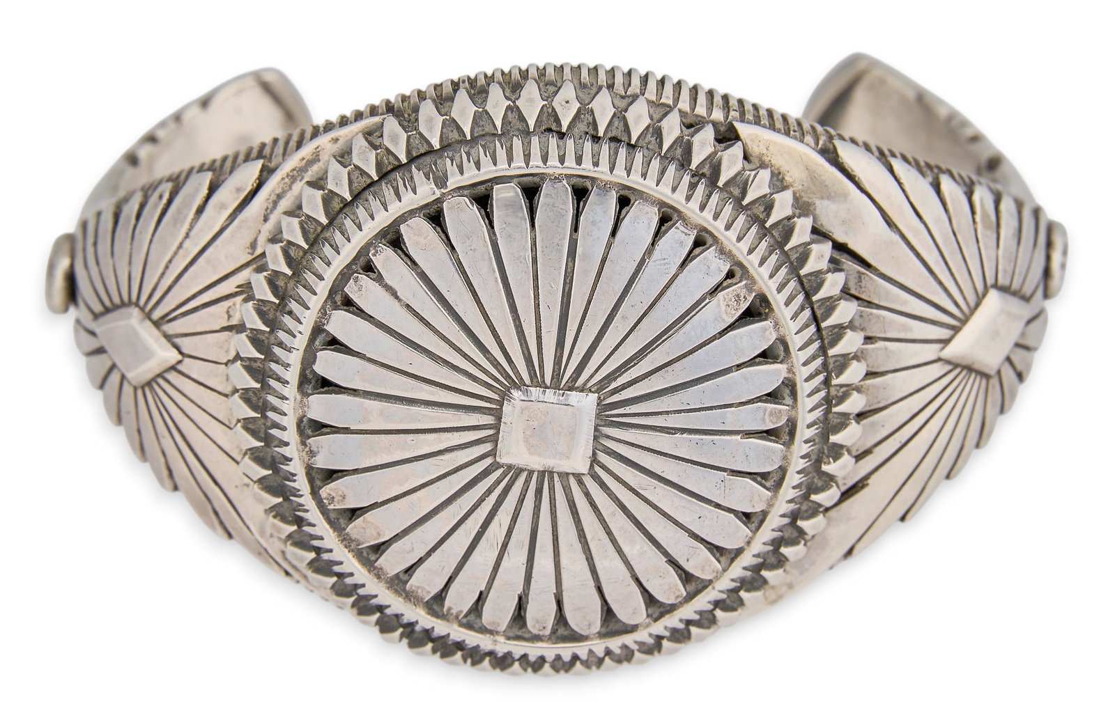 Sterling Silver Concho Motif Cuff: Native American sterling silver cuff bracelet, with concho motif and stamped details, marked by maker Circumference: 7.25 in. Total weight: 87.6 g