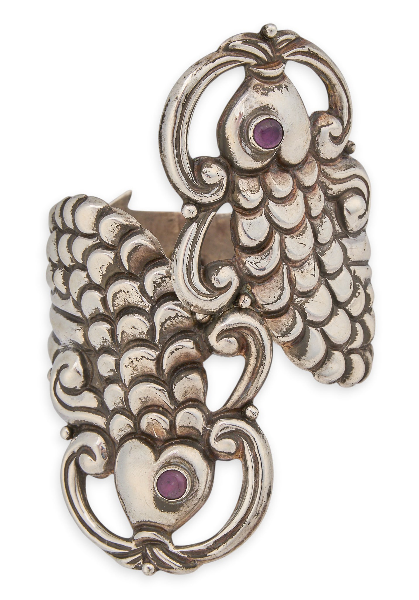 Mexican Sterling & Amethyst Fish Cuff: Mexican sterling silver hinged cuff bracelet, with dual fish motif, set with round amethyst stones to eyes, marked "925 Hecho en Mexico" Circumference: 7 in. Total weight: 62.3 g