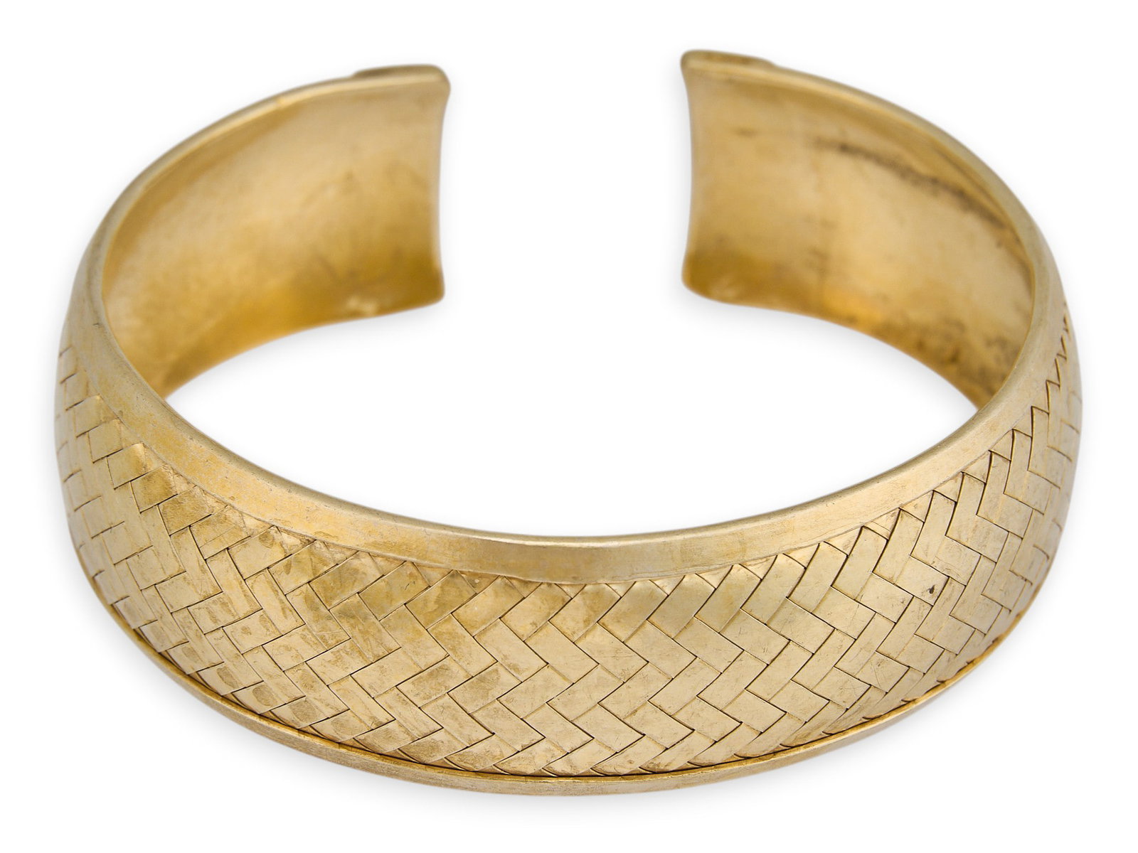 Sterling Silver Gold Vermeil Cuff Bracelet: Sterling silver gold vermeil cuff bracelet, with herringbone woven texture, marked "925" Circumference: 7.25 in. Total weight: 33.5 g