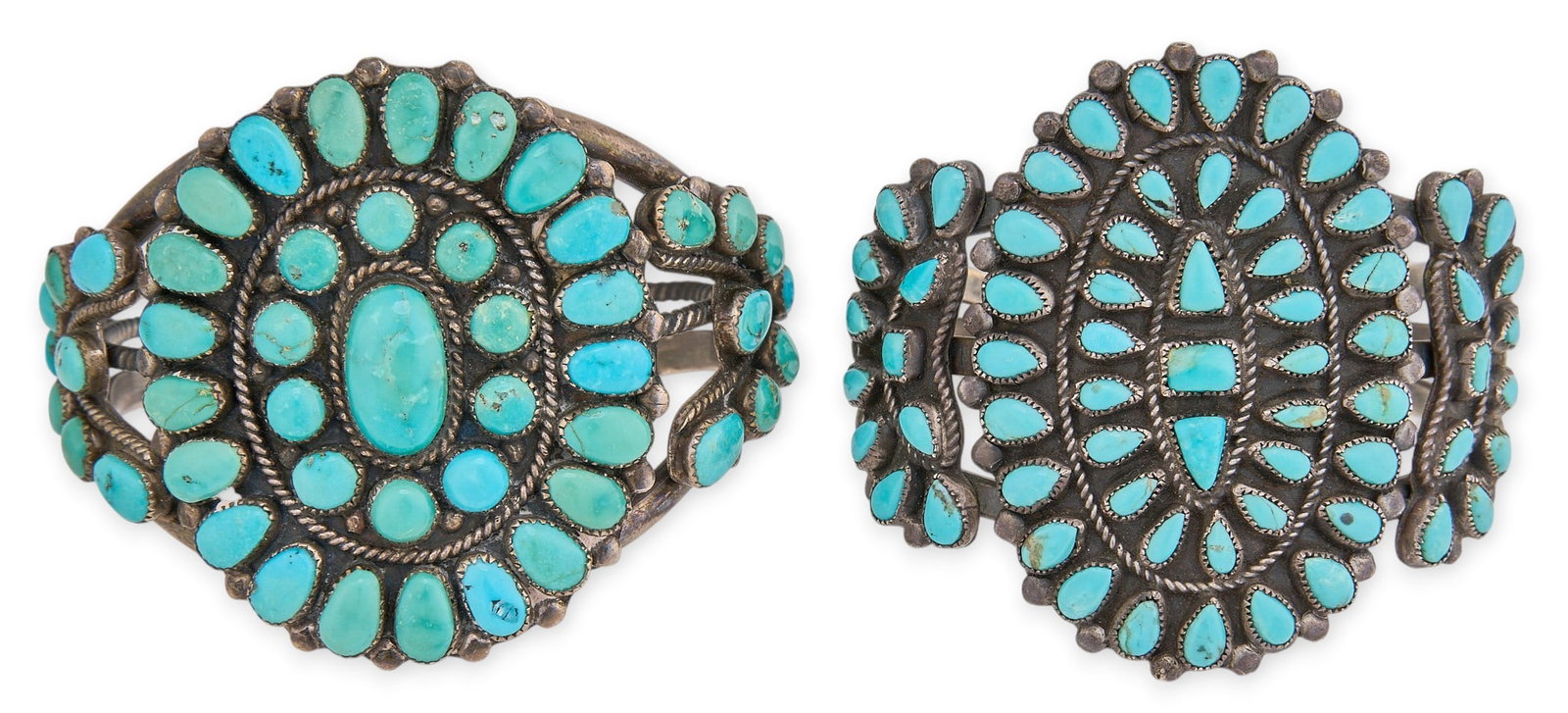 (2) Native American Sterling & Turquoise Cluster Cuffs: Two sterling silver cuff bracelets, set with turquoise stones in cluster design, one signed "Tsabetsaye, Zuni" Circumference: 6.25 in. / largest Total weight: 116.9 g Provenance: 