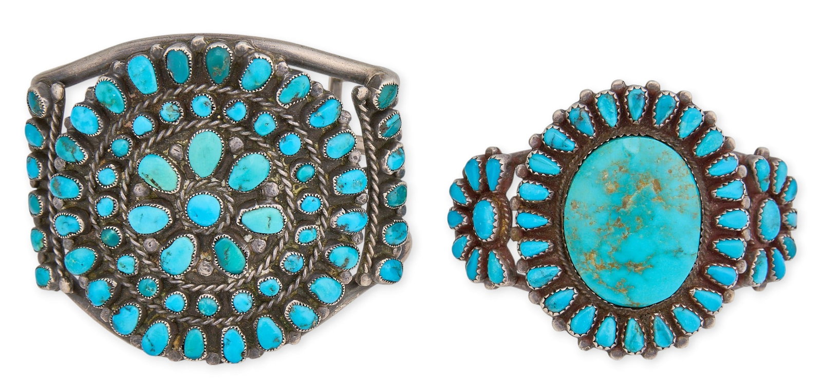 (2) Sterling & Turquoise Cluster Cuffs: Two sterling silver cuff bracelets, set with turquoise stones in cluster design Circumference: 6.75 in. / largest Total weight: 111.9 g Provenance: Property from a home in San Antonio, Texas