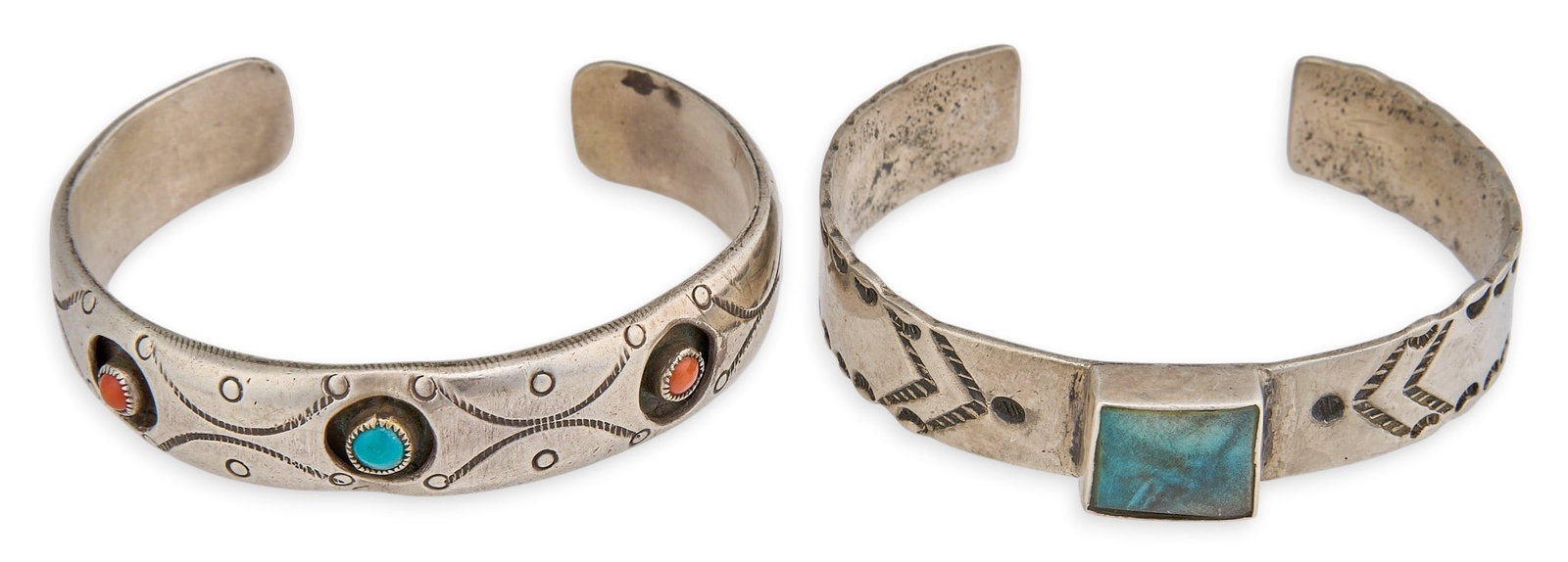(2) Vintage Southwestern Sterling Cuffs: Two vintage Southwestern sterling silver cuffs, one featuring turquoise and coral cabochons in shadowbox style settings, the other with single square-cut turquoise, both featuring stamped details Circ