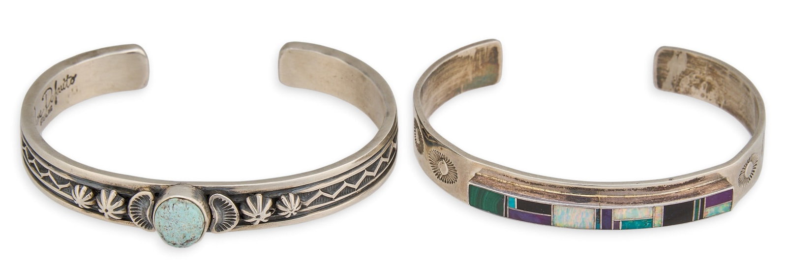 (2) Native American Sterling & Multi-Stone Cuffs: Two Native American sterling silver cuffs, one set with single turquoise cabochon, one set with multi-stone inlay, featuring stamped details, both signed to interior Circumference: 6.75 in. / each