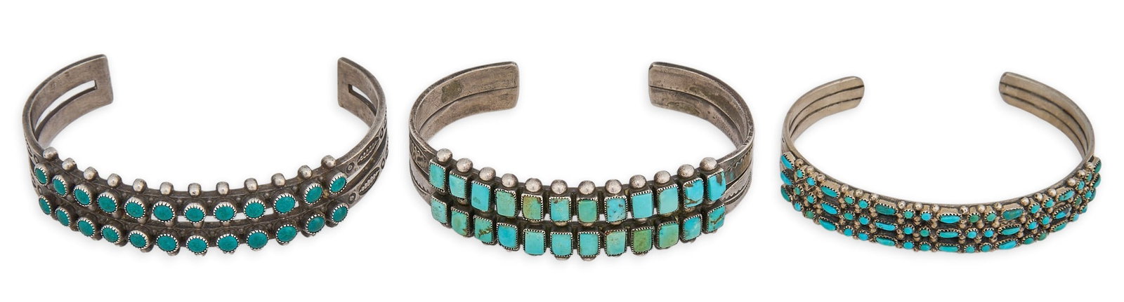 (3) Zuni Style Sterling & Turquoise Cuffs: Three Zuni style cuff bracelets, each set with turquoise stones in cluster design, marked "Sterling" Circumference: 7 in. / largest Total weight: 79.9 g