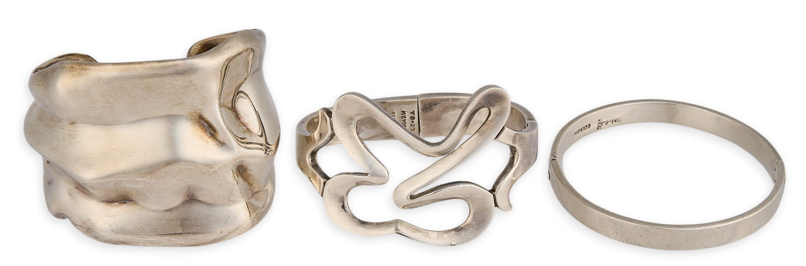 (3) Mexican Sterling Silver Cuffs: Collection of three marked Mexican sterling silver cuffs, various designs Circumference: 7.25 in. / largest Total weight: 173.09 g Provenance: Property from a home in San Antonio,