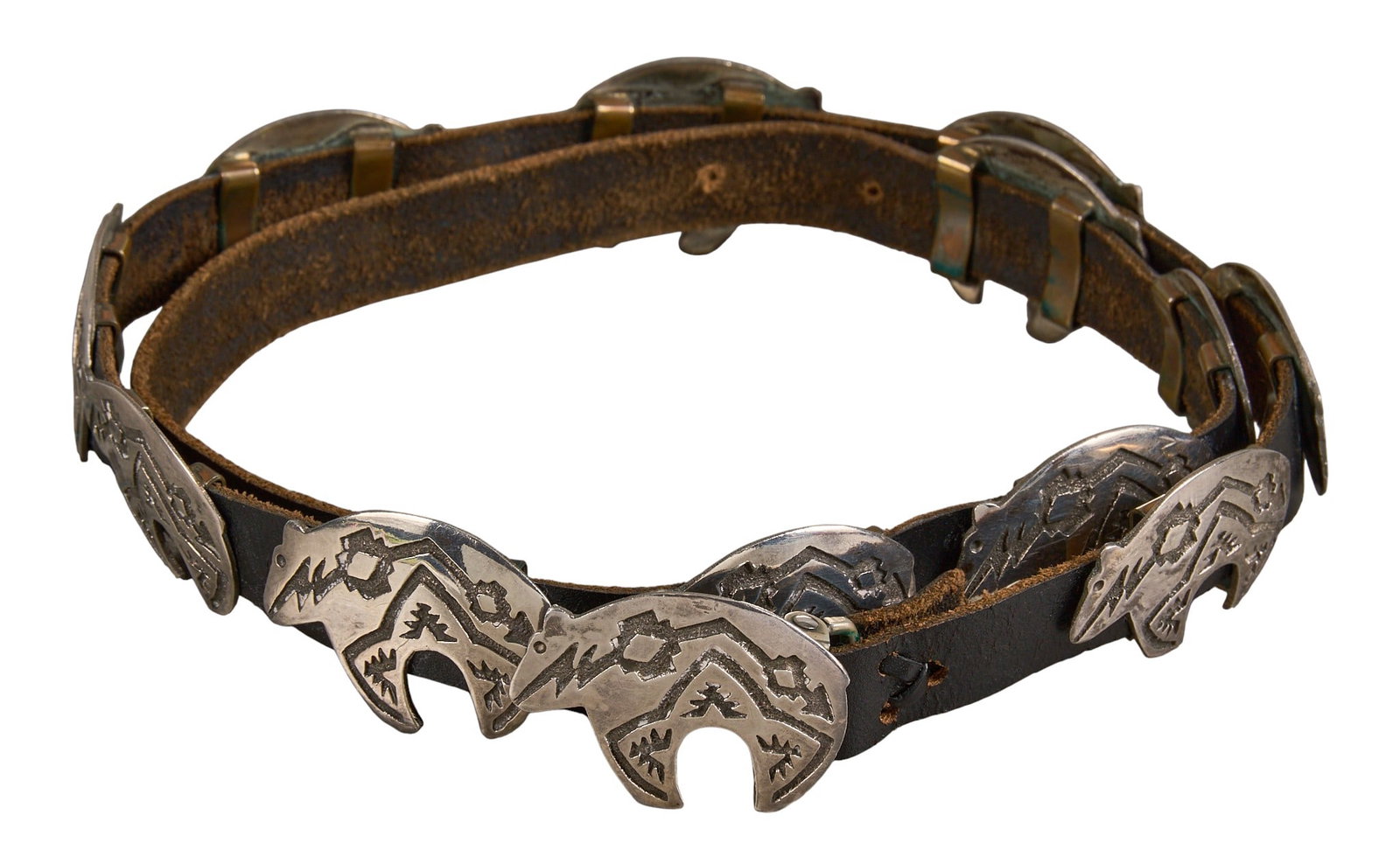 Navajo Sterling Silver Bear Motif Concho Belt: Navajo sterling silver concho belt, with bear motifs and stamped details, with twelve conchos and buckle on black leather belt, marked "BK Sterling" to buckle Length: 39 in. Total weight: 21