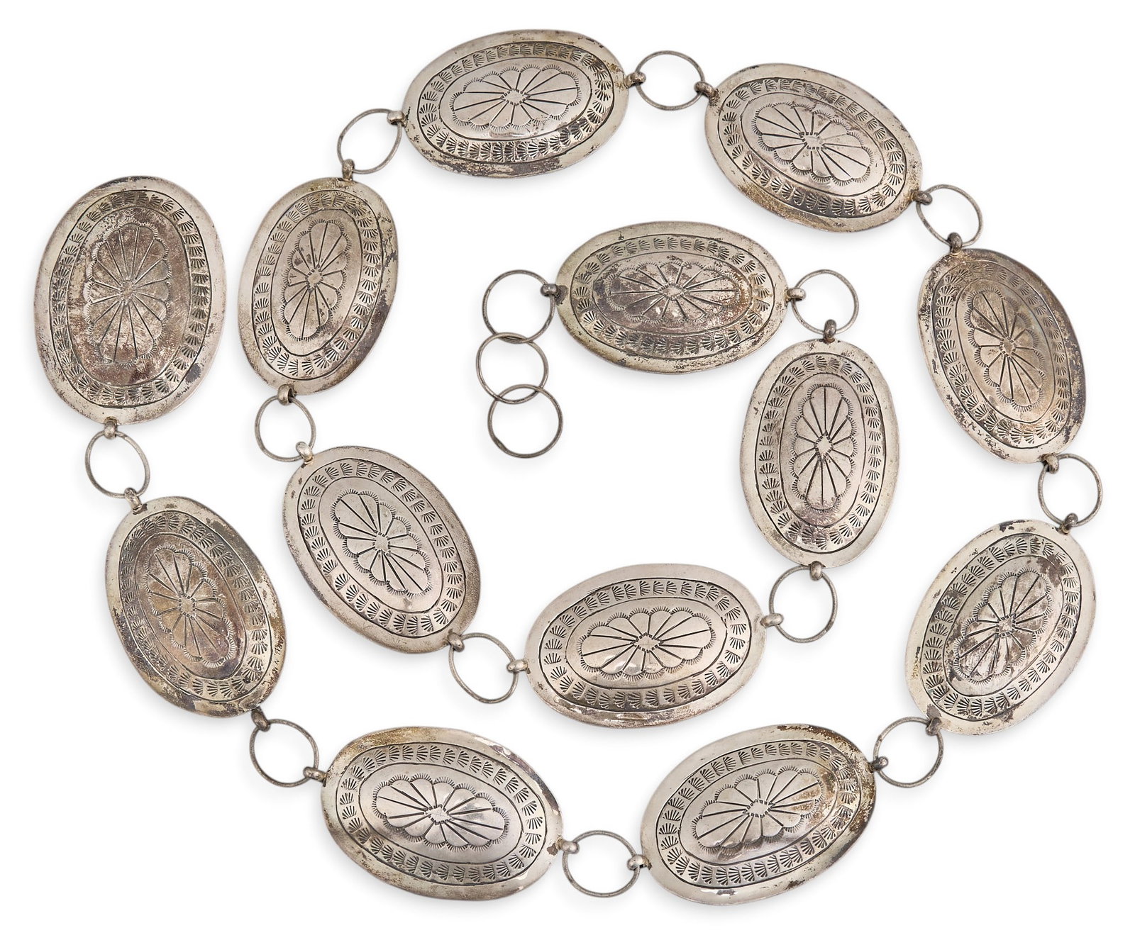 Sterling Silver Concho Belt: Sterling silver concho belt, with twelve conchos and buckle, marked "Sterling" to buckle Length: 40 in. Total weight: 160.6 g