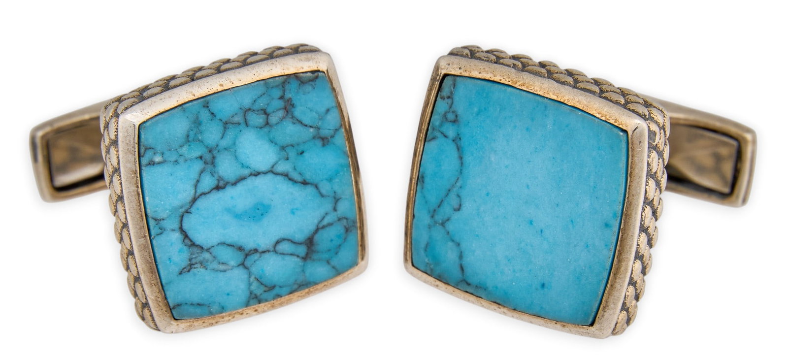 Pair of Sterling &Turquoise Cufflinks: Pair of sterling silver cufflinks, set with square-cut turquoise stones and stamped borders, marked "Ravi Ratan" and "925 Sterling" Size: 0.5 in. x 0.5 in. Total weight: 16.9 g