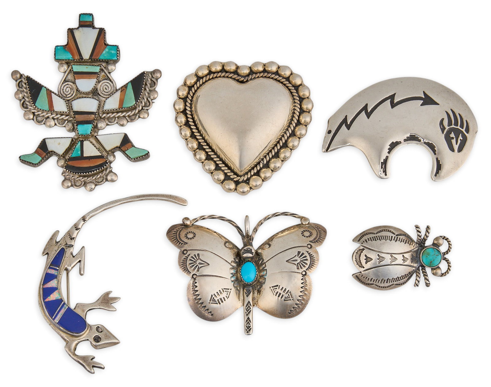 (6) Southwestern Sterling & Multi-Stone Pins: Six Southwestern sterling silver pins, set with various multi-stone inlay, depicting various Southwestern motifs, several marked Size: 2.5 in. x 1.5 in. / largest Total weight: 72.3 g