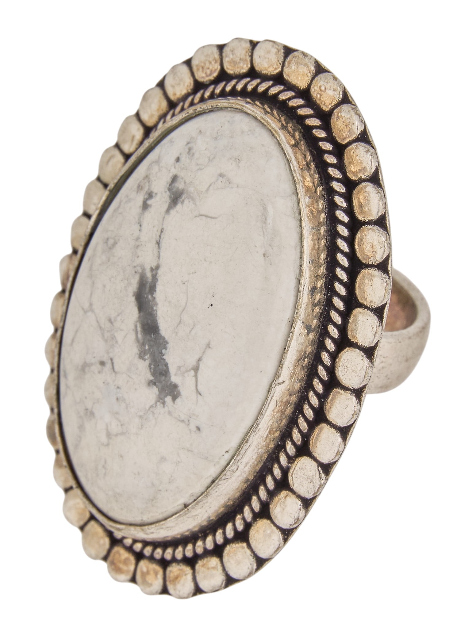 Sterling & White Buffalo Ring: Sterling silver ring, set with oval-cut white buffalo turquoise, featuring twisted rope motifs Size: 7.25 Total weight: 19.2 g