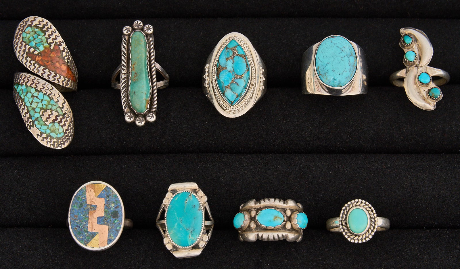 (9) Southwestern Sterling and Turquoise Rings: Nine Southwestern sterling silver rings, featuring turquoise and coral, and assorted Southwestern motifs, several marked Sizes: 4-8 Total weight: 50.2 g Provenance: Property from the collection of a