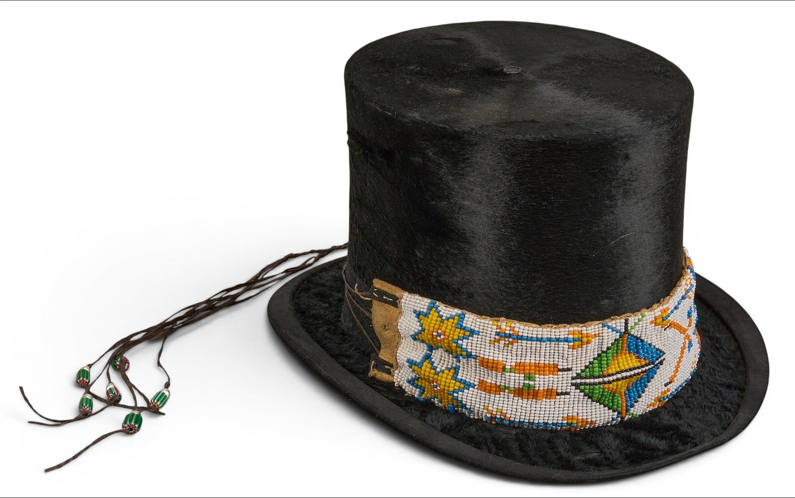 Vintage Beaver Hat: Vintage Plains Indian style beaver pelt top hat with brain tanned hide band, and size braided strands with silver pearls and trade beads height 6.5 in. x width 9 in. x depth 11.5 in. 