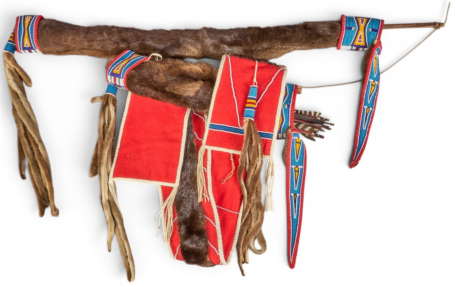 Northern Plains Otter Bow and Quiver: Northern Plains Native American made bow and quiver, museum-quality piece handcrafted from dyed wood, trade beads, and otter pelts; circa 2002 height 27 in. x width 51 in. x depth 3 in. Provenance: Pr