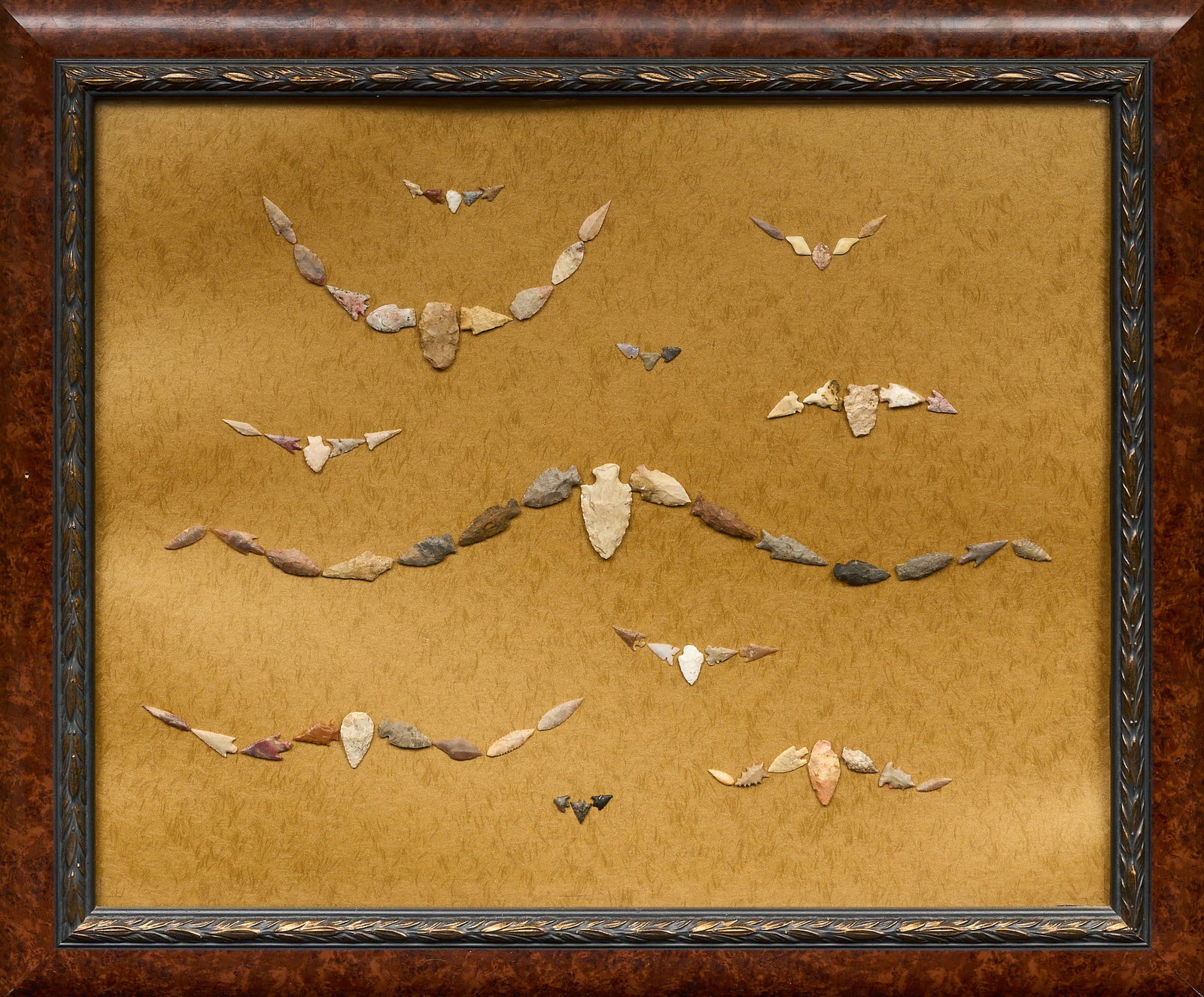 Jerry Bostic, "Ghostly Herd" 2025: Ghostly Herd, Jerry Bostic (San Antonio, Texas 20th century), 2025, framed collection of seventy-two pre-1600 stone projectile points, signed on verso height 29.5 in. x width 35.5 in. Provenance