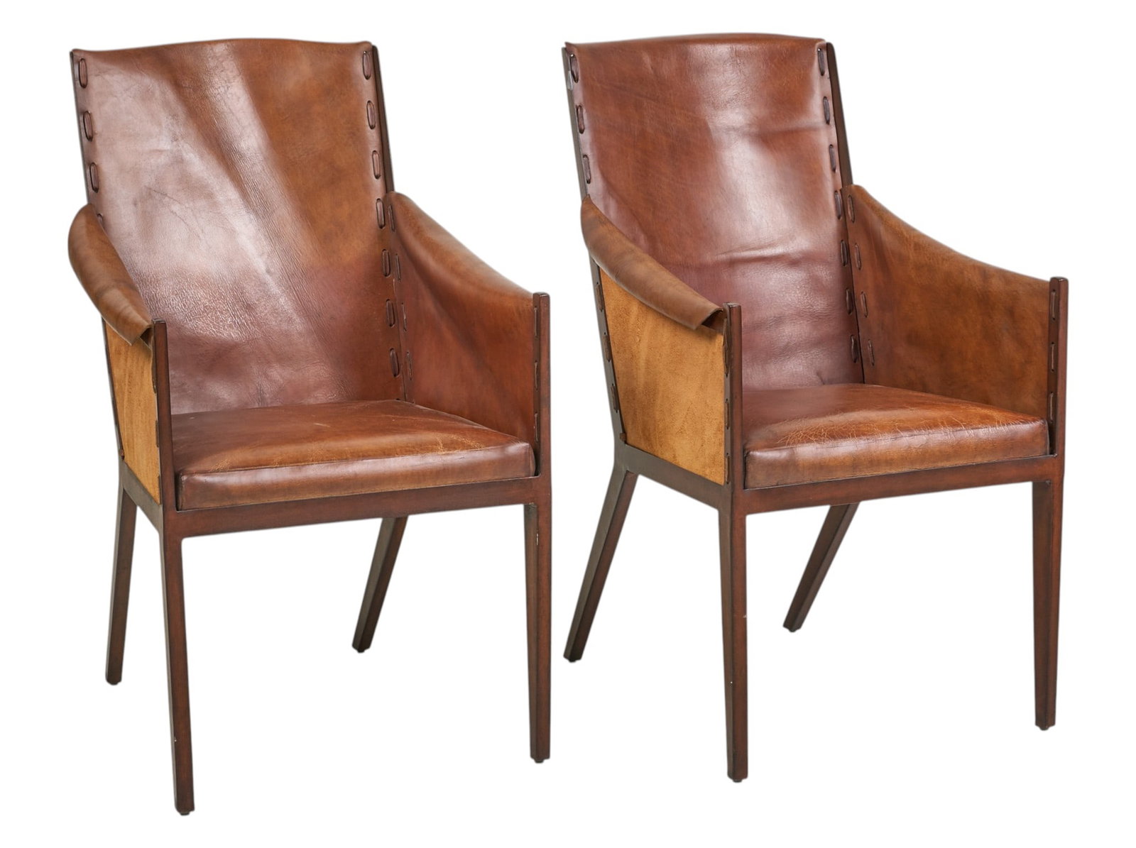 Pair of Gunnison Chairs: Pair of Gunnison Chairs by Hickory Chair with angular frame, distressed leather and exposed stitching height 40 in. x width 24 in. x depth 28 in. Provenance: Property from a home in San
