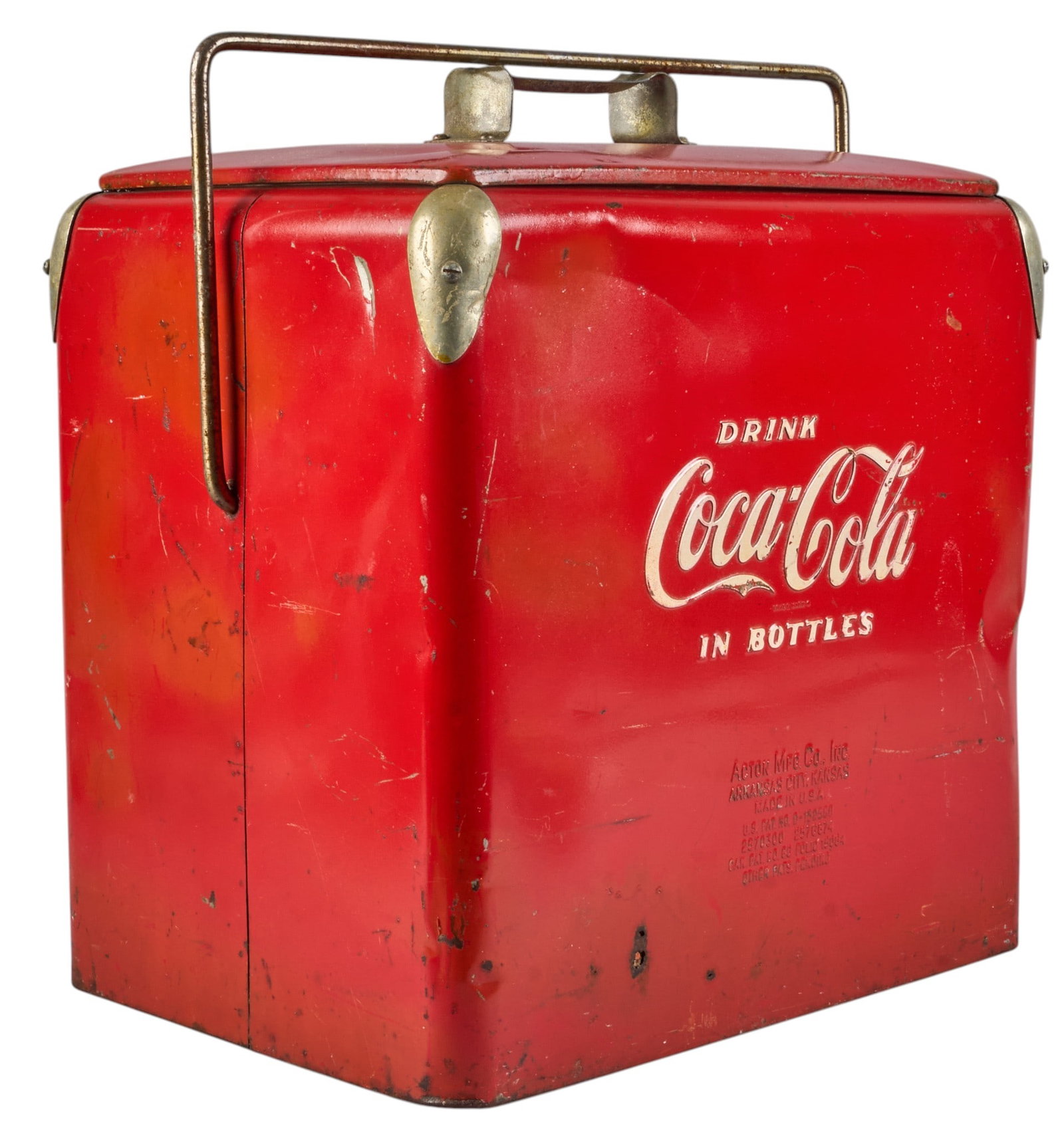 Vintage Coca-Cola Metal Cooler: Vintage red Coca-Cola cooler with hinged lid, carrying handle, and a bottle opener height 19 in. x width 18 in. x depth 12 in. Provenance: Property from a home in Victoria, Texas 