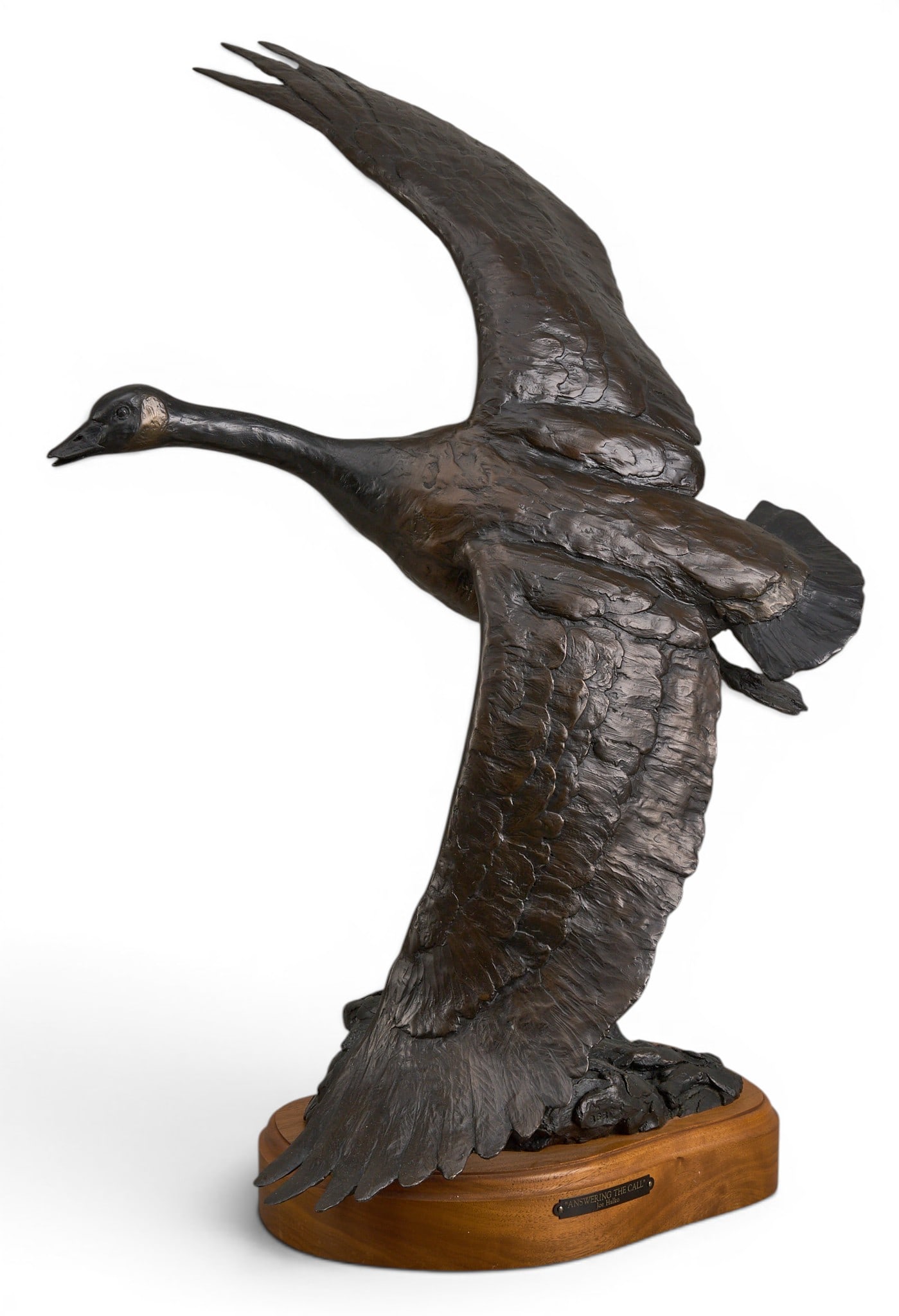 Joe Halko, "Answering the Call": Joe Halko (Montana, 1940-2009), "Answering the Call", goose in flight, artist-cast bronze sculpture on wooden base, incised signature and edition number 2/12 height 22 in. x width 12