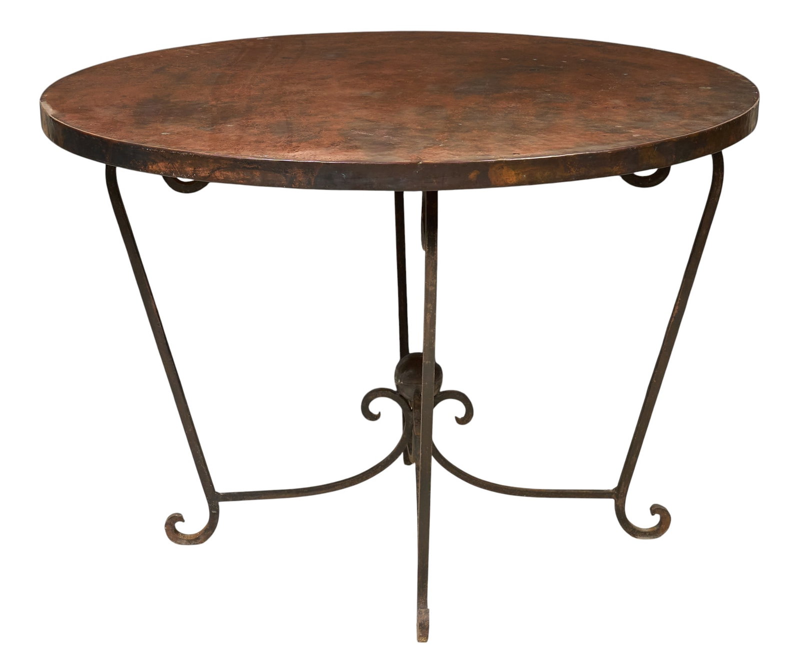 Hammered Copper Table: Hammered copper table with scrolled iron base height 29 in. x diameter 42 in. Provenance: Property from a home in San Antonio, Texas 